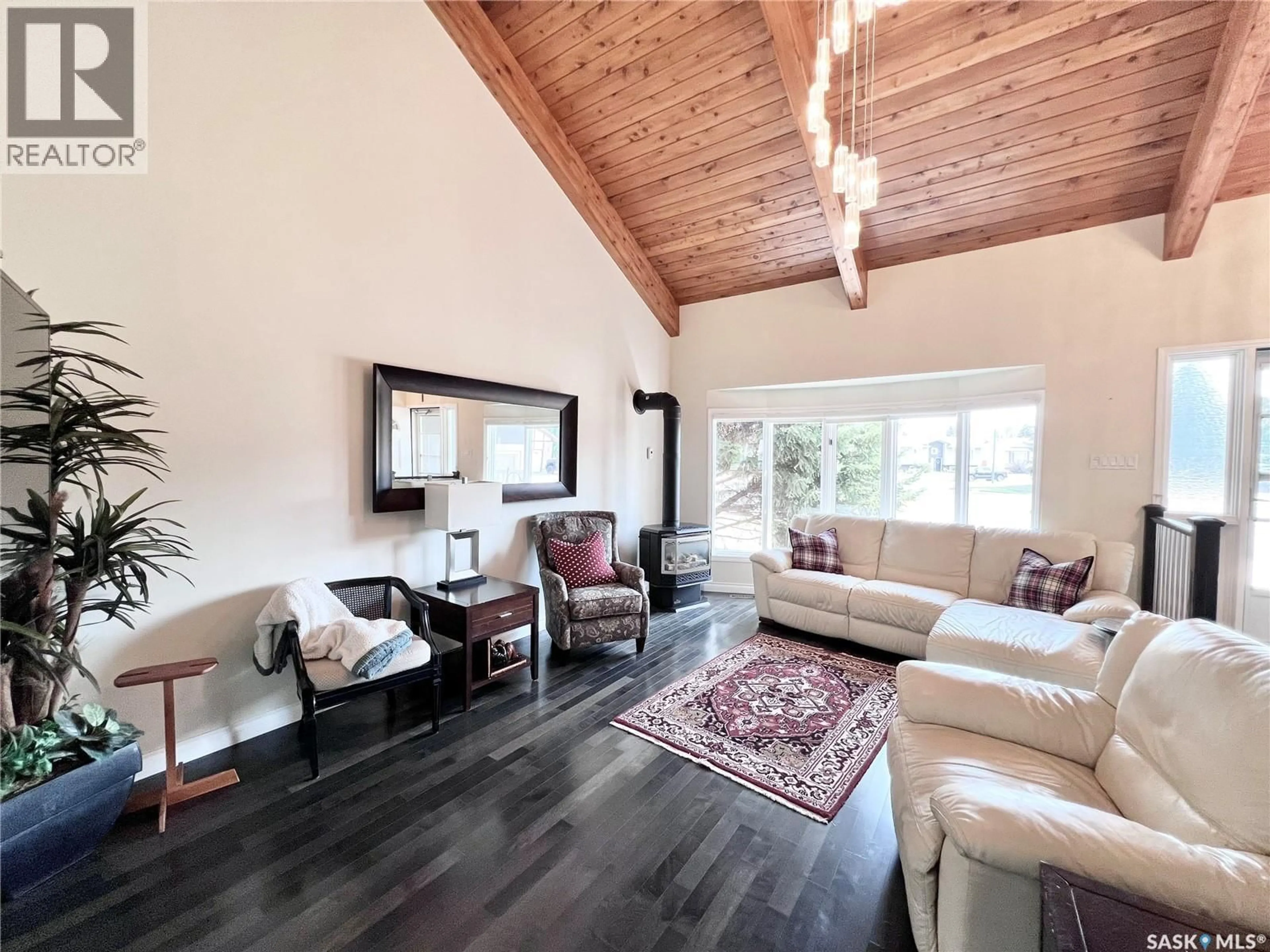 Living room with furniture, wood/laminate floor for 5 POPLAR PLACE, Outlook Saskatchewan S0L2N0