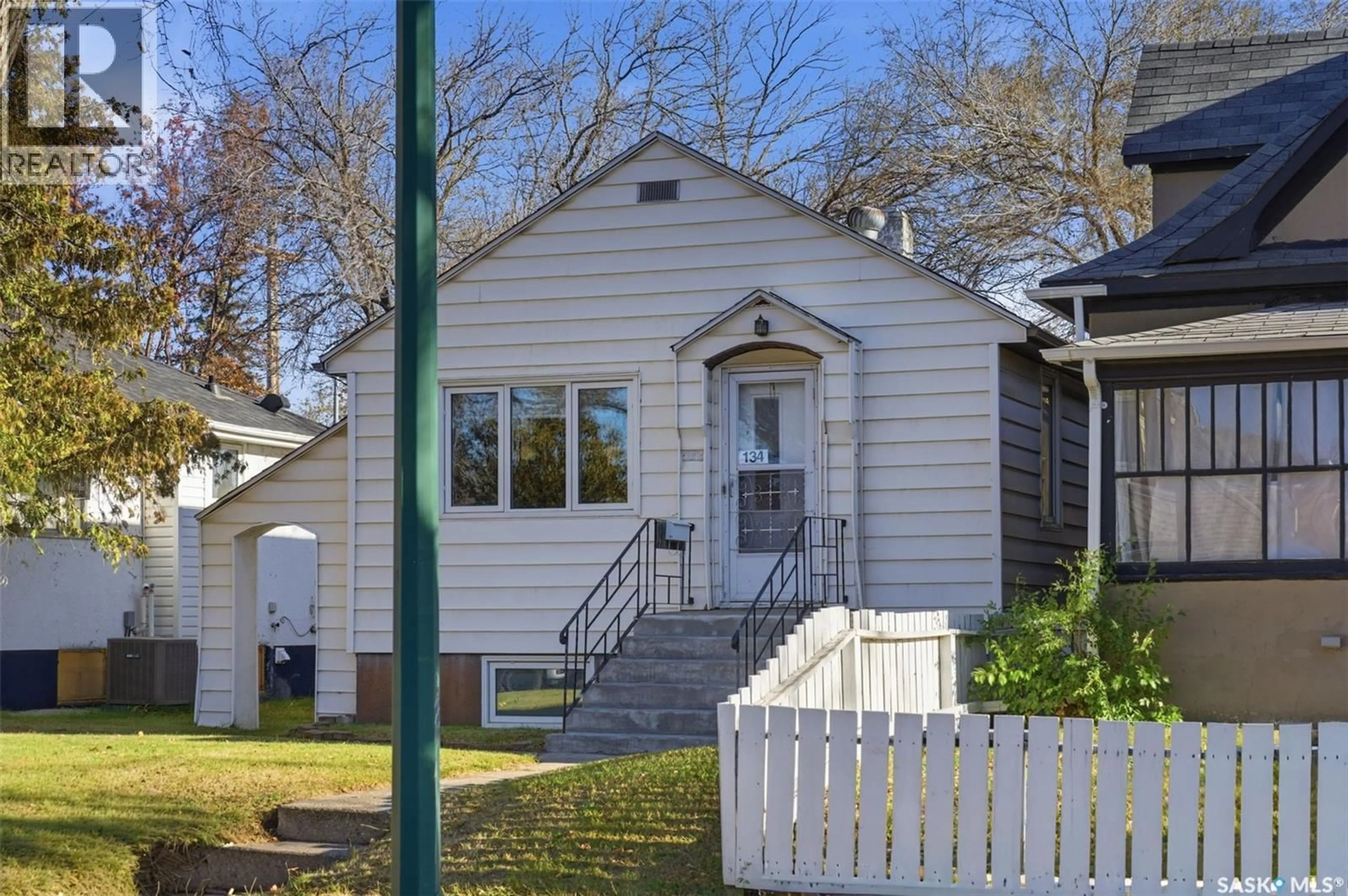 Home with vinyl exterior material, street for 134 G AVENUE, Saskatoon Saskatchewan S7I1Y8