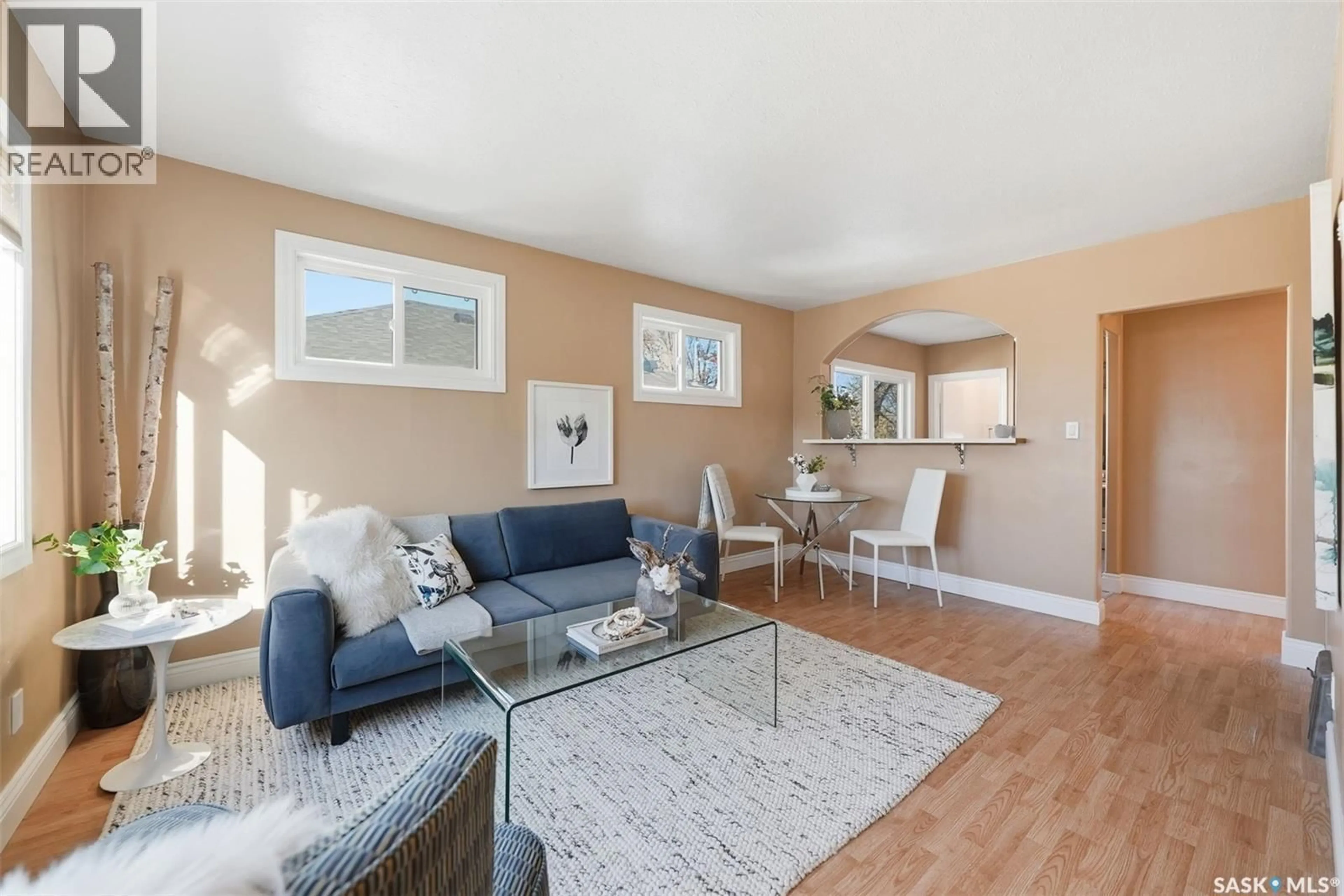 Living room with furniture, wood/laminate floor for 134 G AVENUE, Saskatoon Saskatchewan S7I1Y8