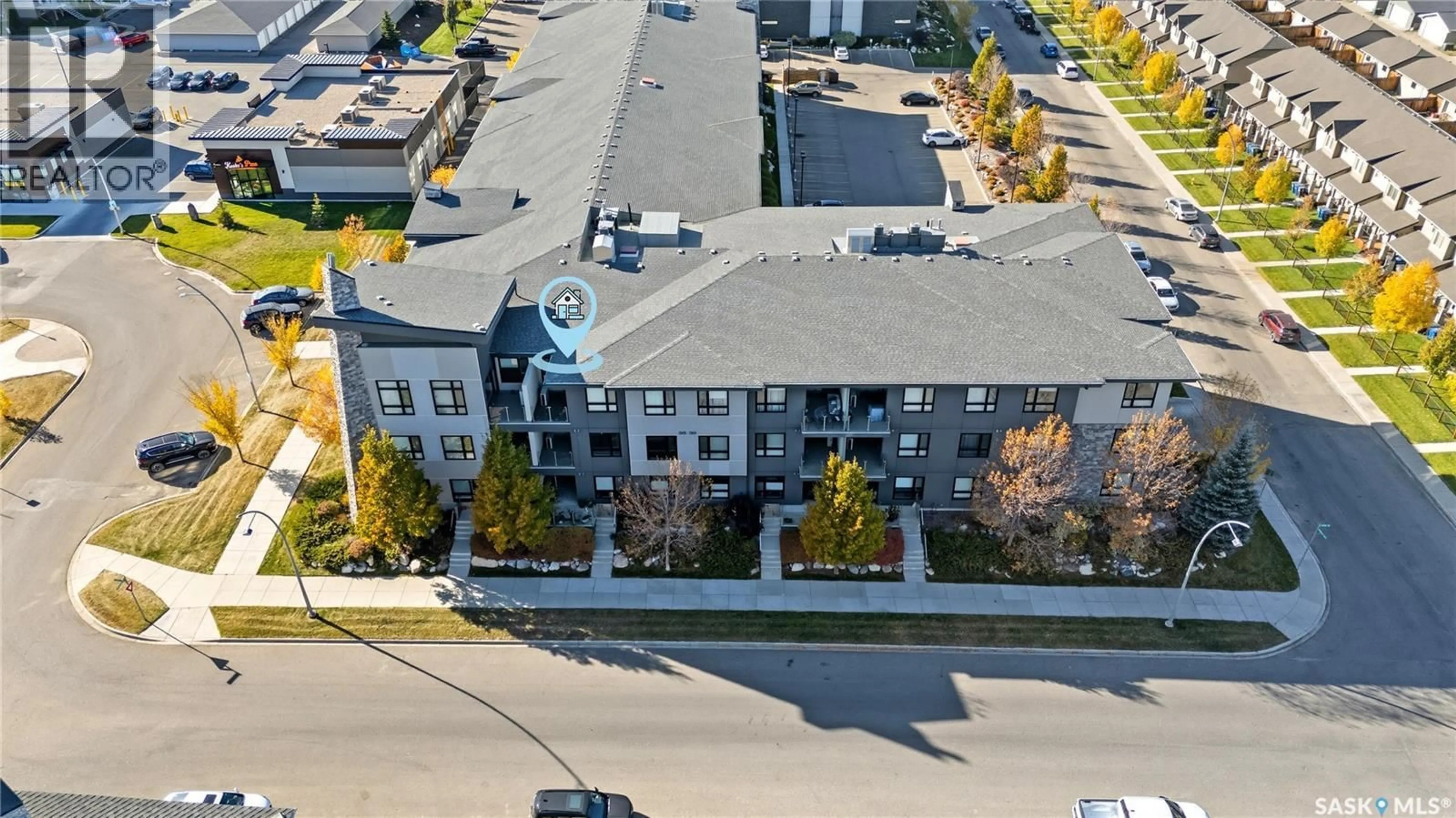 A pic from outside/outdoor area/front of a property/back of a property/a pic from drone, unknown for 235 - 221 EVERGREEN SQUARE, Saskatoon Saskatchewan S7W0P9