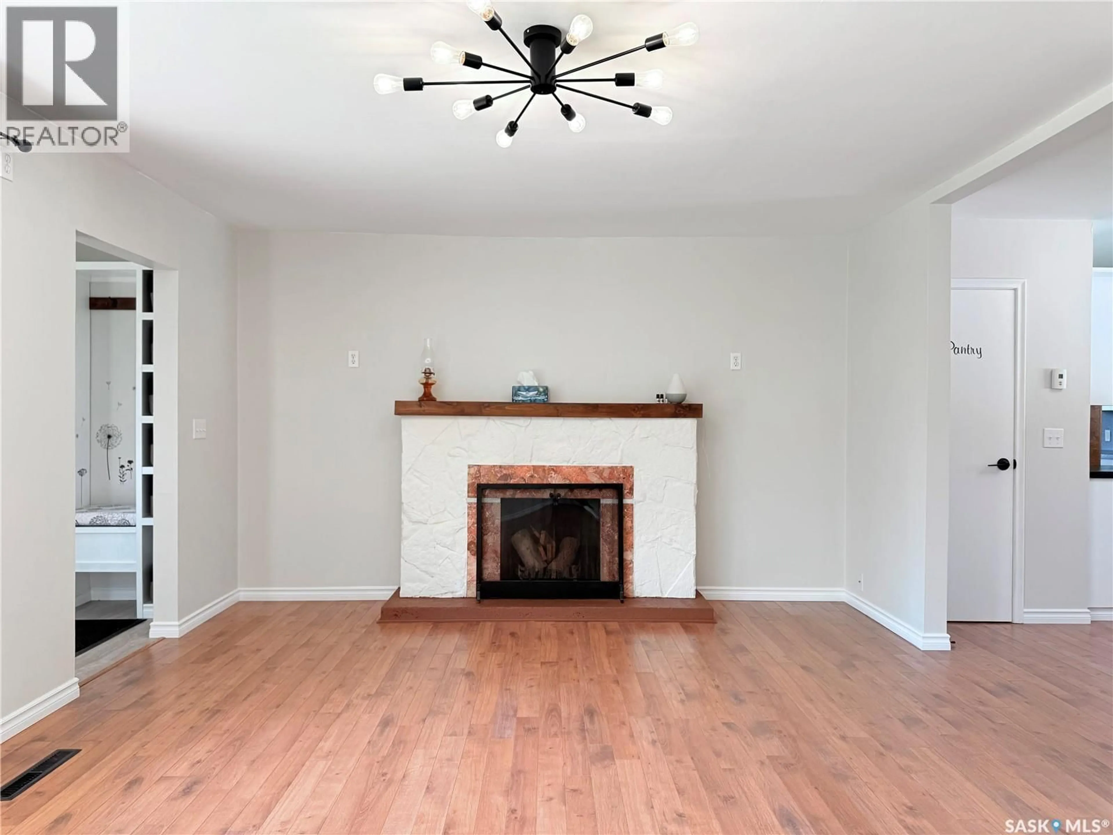 Living room with furniture, wood/laminate floor for 201 OTTAWA STREET, Davidson Saskatchewan S0G1A0