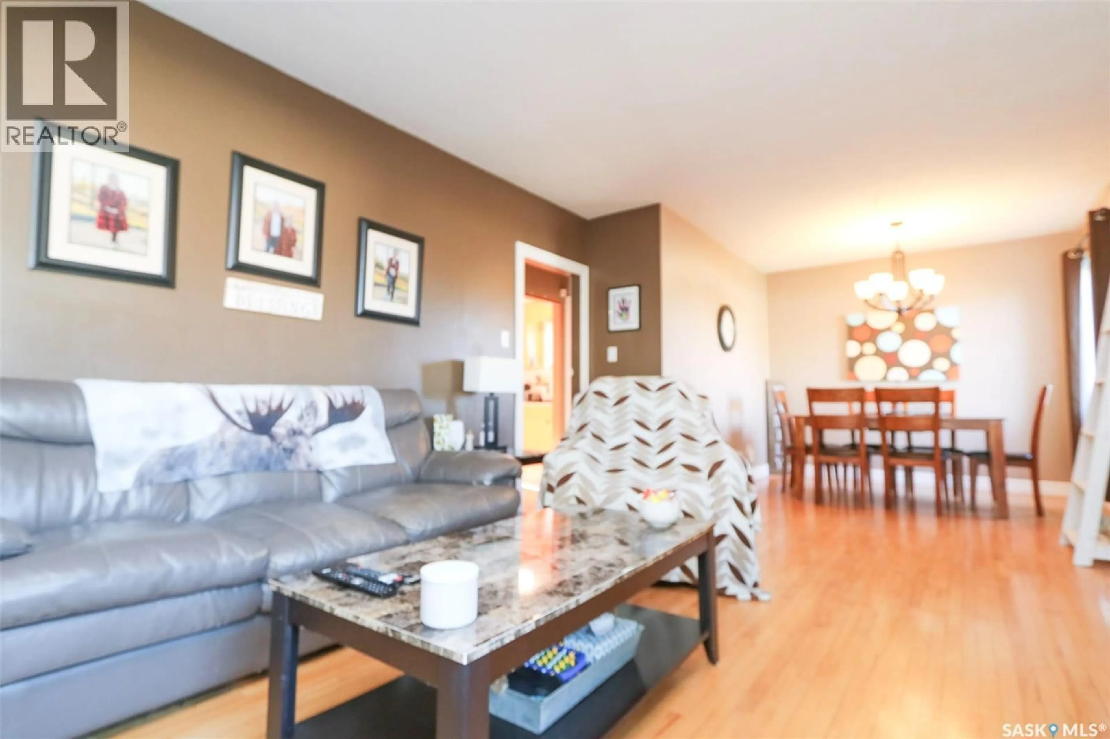 Living room with furniture, wood/laminate floor for 519 SEVENTH AVENUE, Melville Saskatchewan S0A2P0