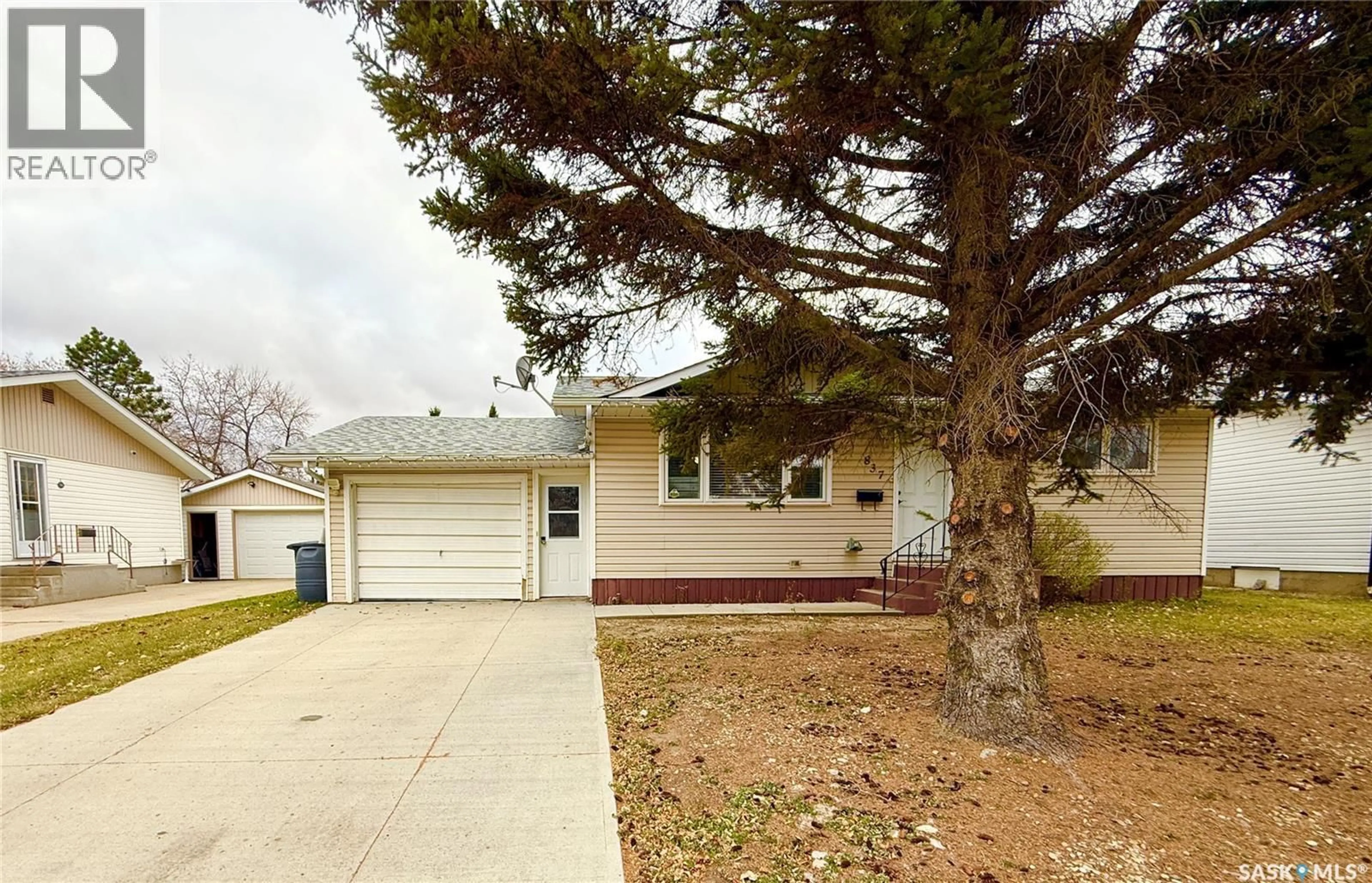 Home with vinyl exterior material, street for 837 14TH STREET, Humboldt Saskatchewan S0K2A0