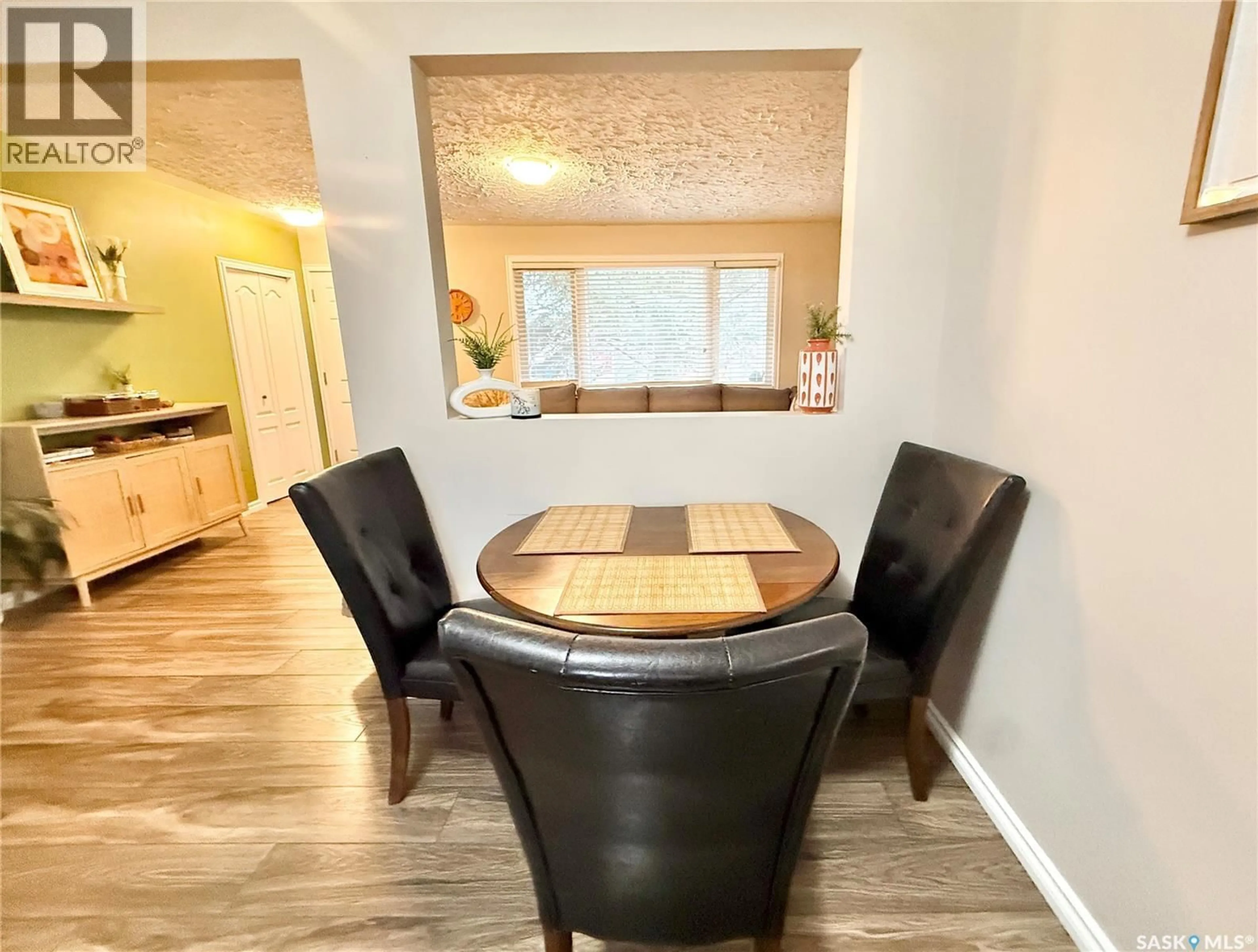 Dining room, wood/laminate floor for 837 14TH STREET, Humboldt Saskatchewan S0K2A0