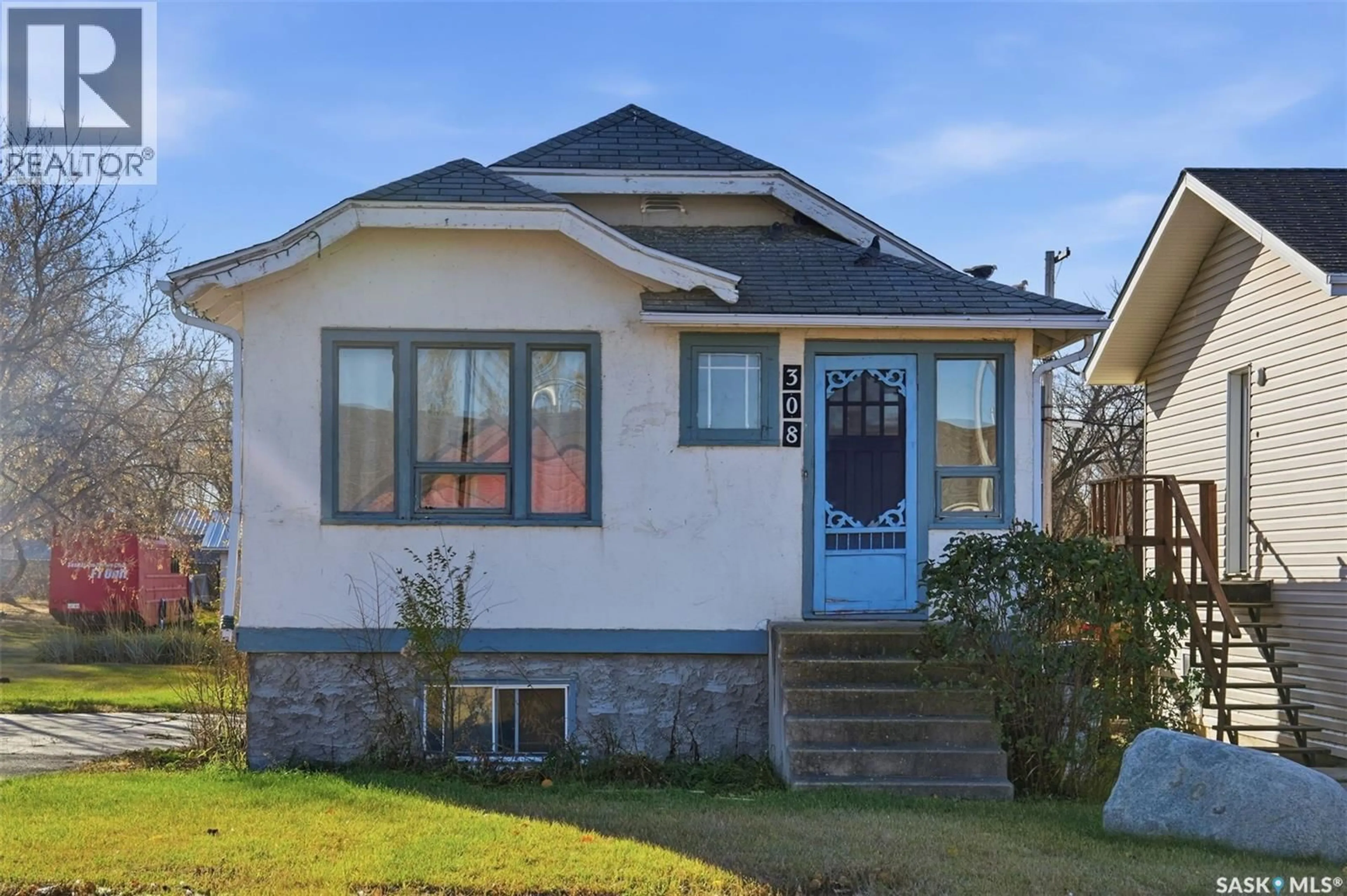 Home with vinyl exterior material, street for 308-310 3RD STREET, Dundurn Saskatchewan S0K1K0