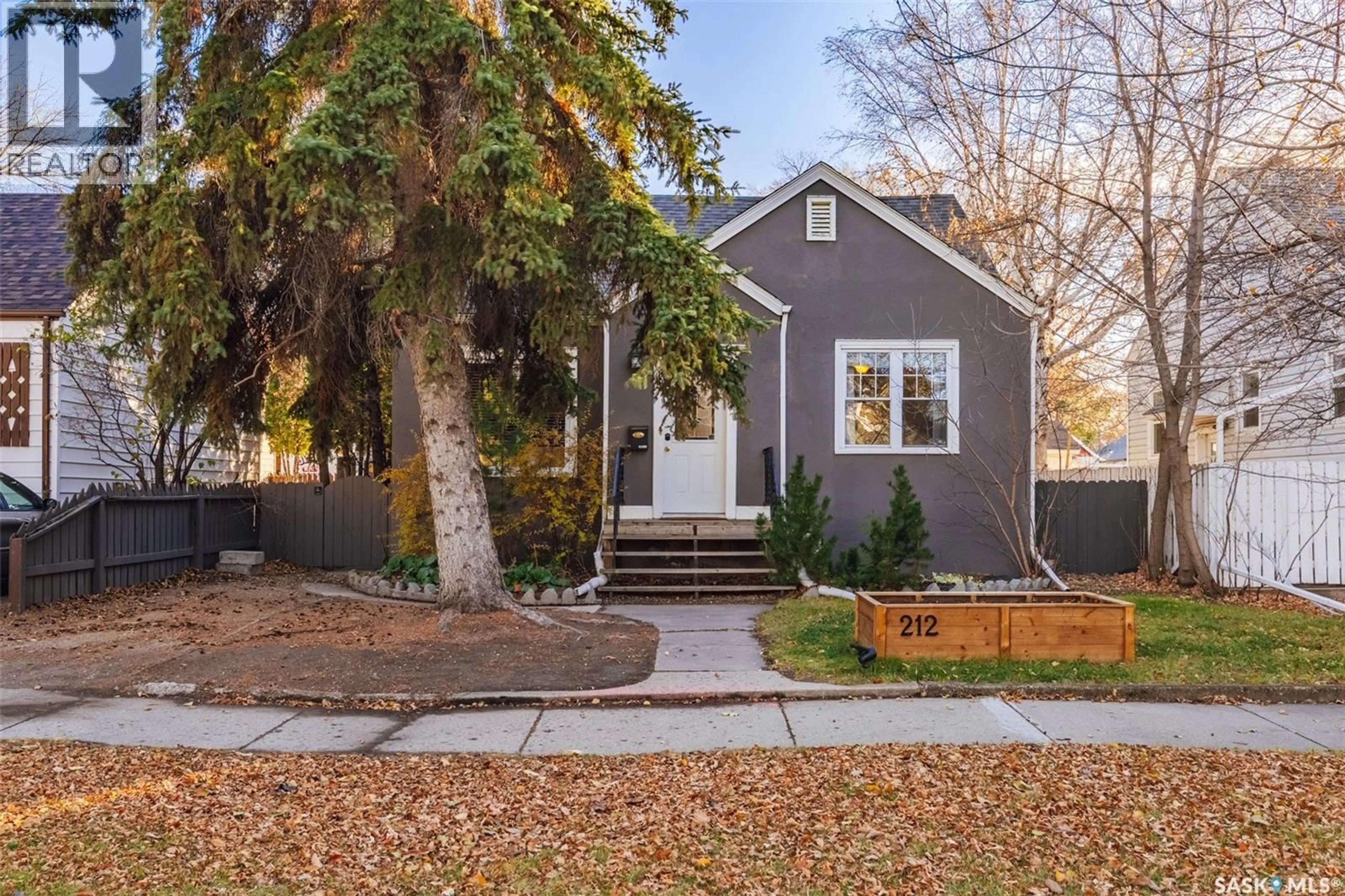 Home with vinyl exterior material, street for 212 4TH STREET, Saskatoon Saskatchewan S7H1J1