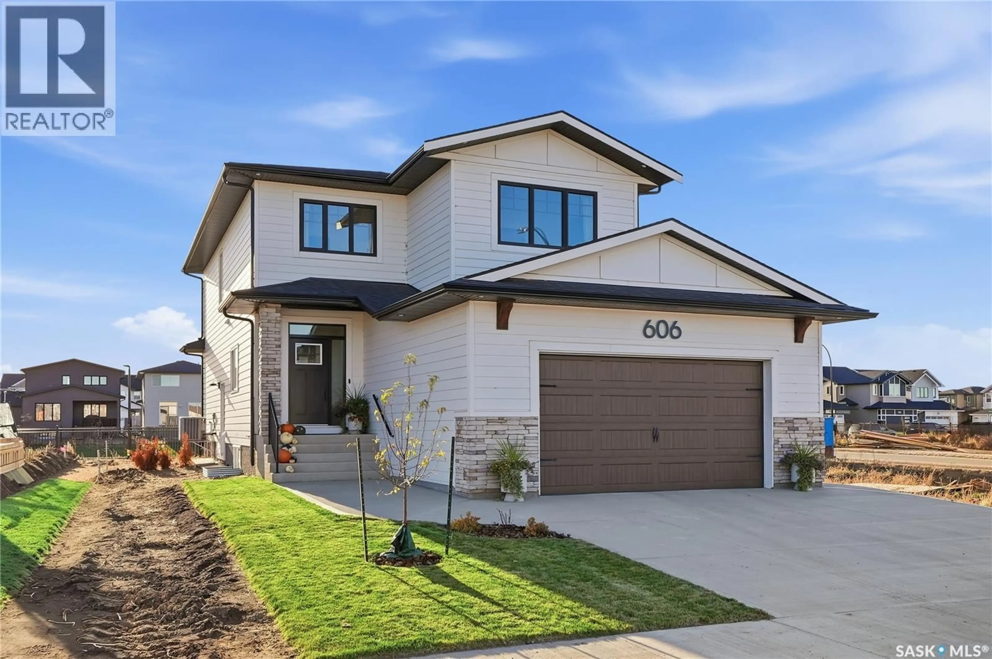 Home with brick exterior material, street for 606 PEPPER BEND, Saskatoon Saskatchewan S7V1T1