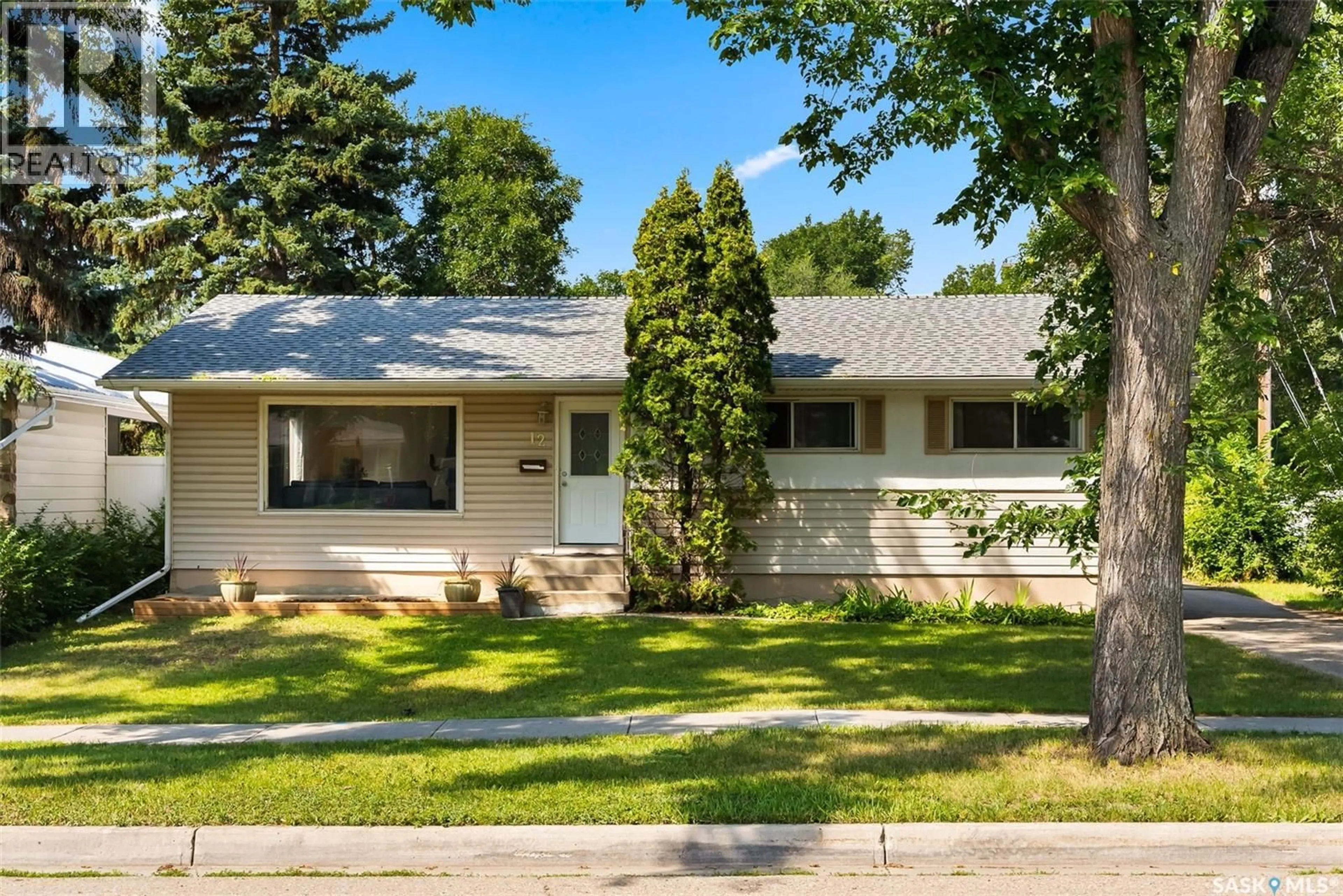Home with vinyl exterior material, street for 12 MASSEY ROAD, Regina Saskatchewan S4S4M7
