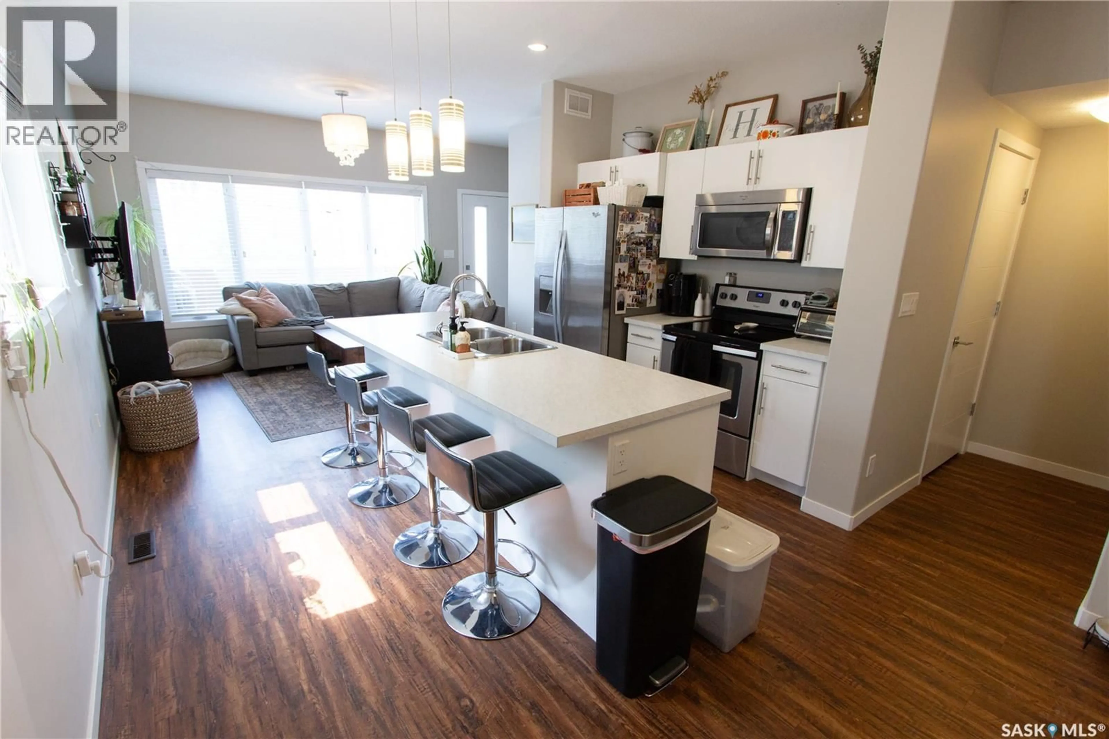 Open concept kitchen, wood/laminate floor for 3913 JAMES HILL ROAD, Regina Saskatchewan S4W0N8