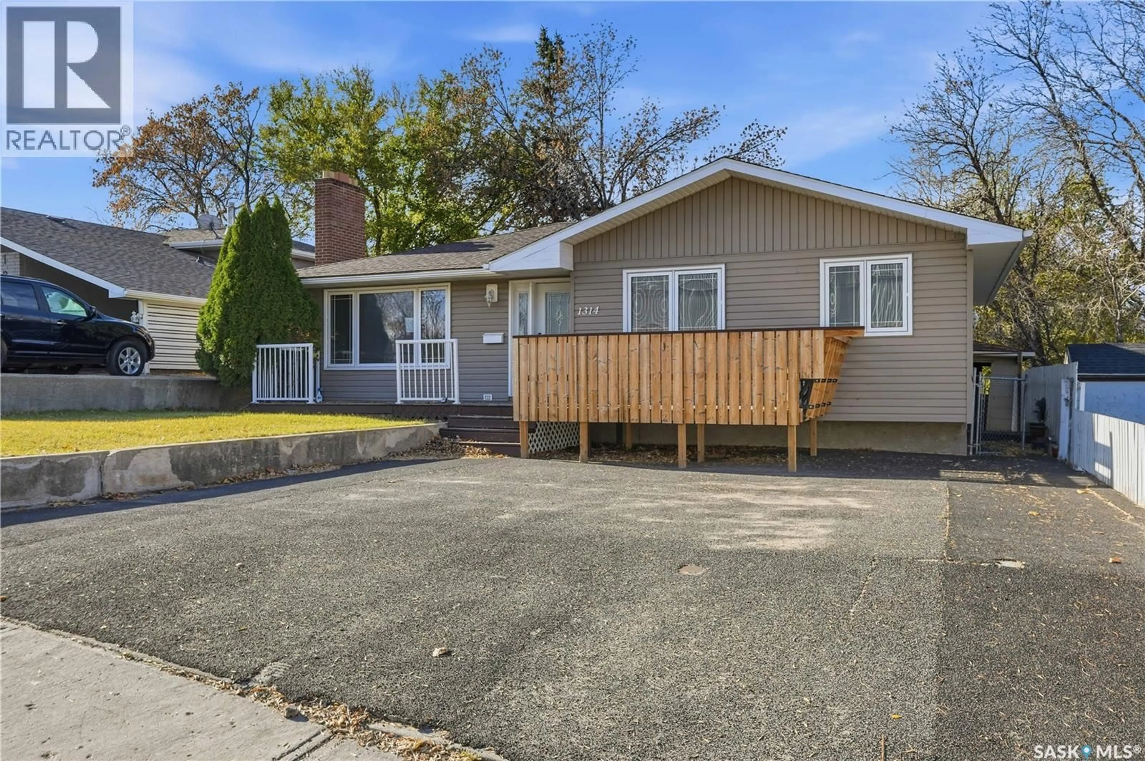 Home with vinyl exterior material, street for 1314 HENLEAZE AVENUE, Moose Jaw Saskatchewan S6H3W2