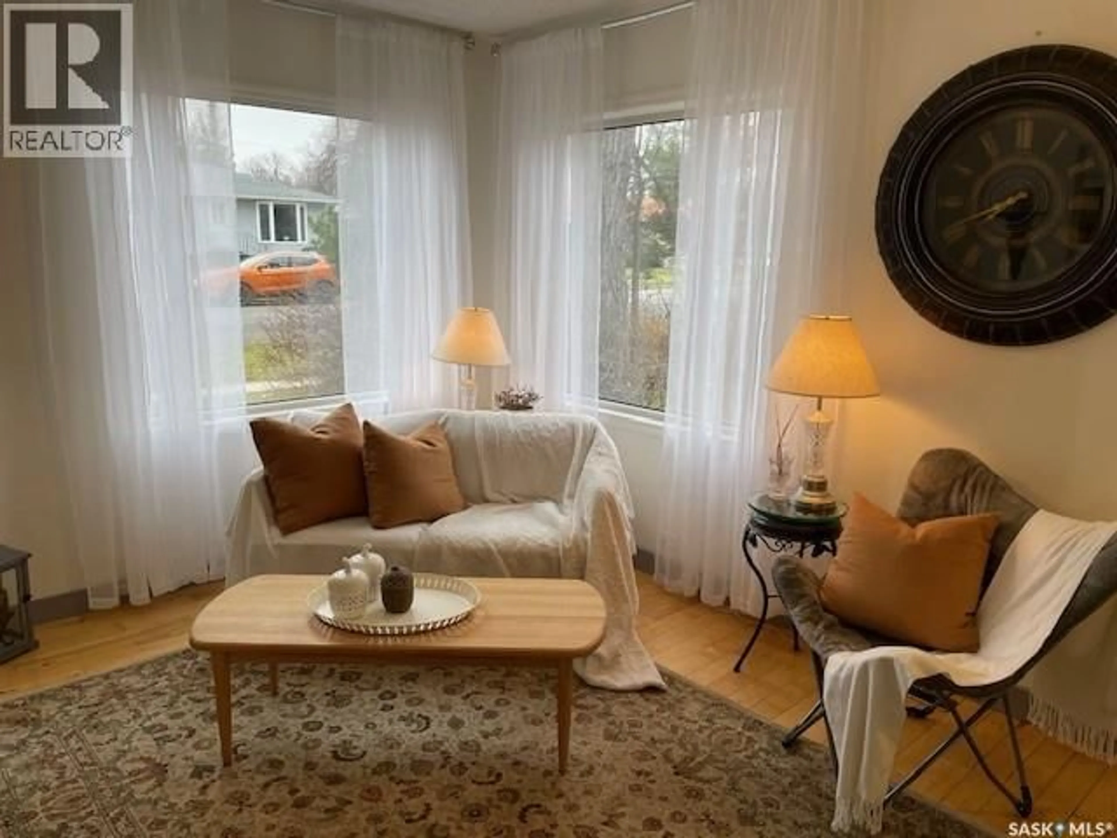 Living room with furniture, wood/laminate floor for 410 1ST STREET, Kipling Saskatchewan S0G2S0