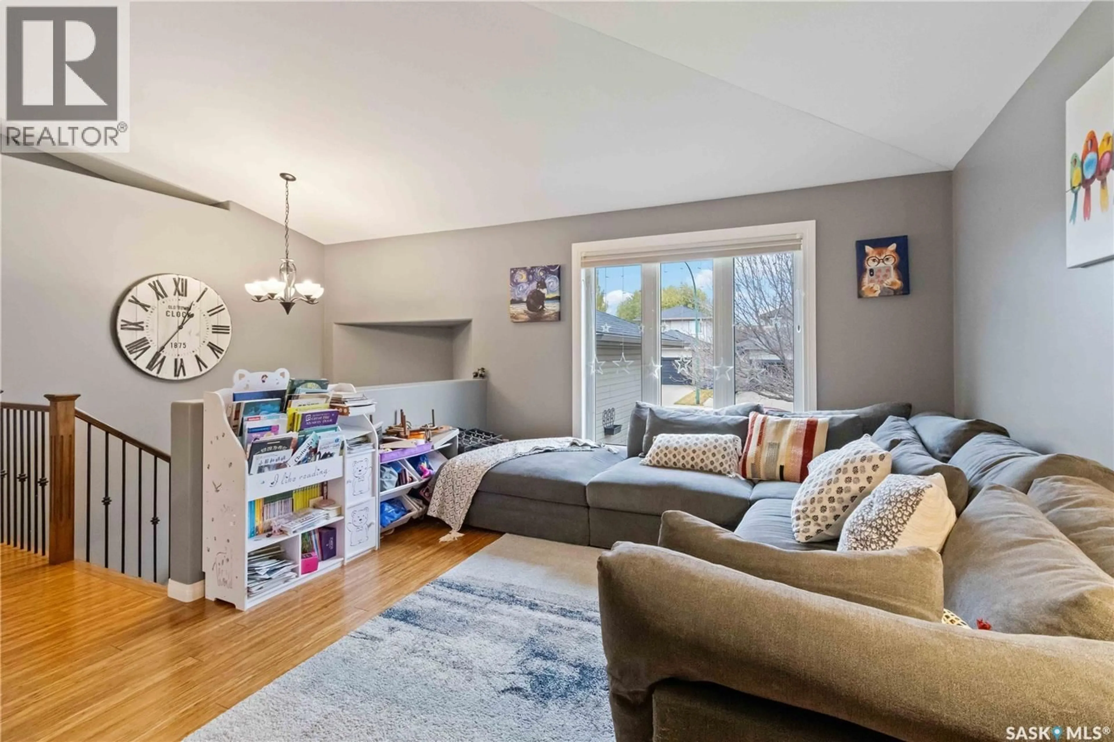 Living room with furniture, wood/laminate floor for 506 KUCEY CRESCENT, Saskatoon Saskatchewan S7N4T3