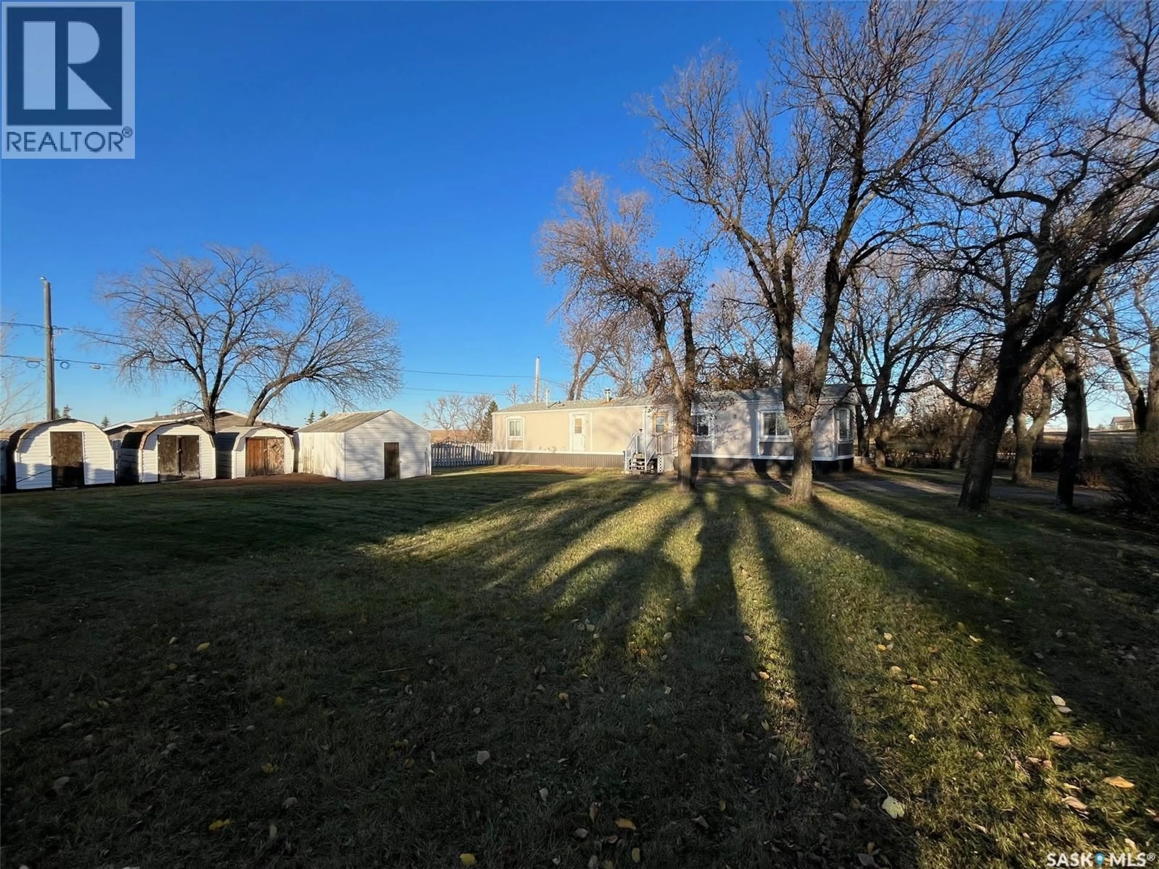 A pic from outside/outdoor area/front of a property/back of a property/a pic from drone, unknown for E - 118 2 AVENUE, Lafleche Saskatchewan S0H2K0