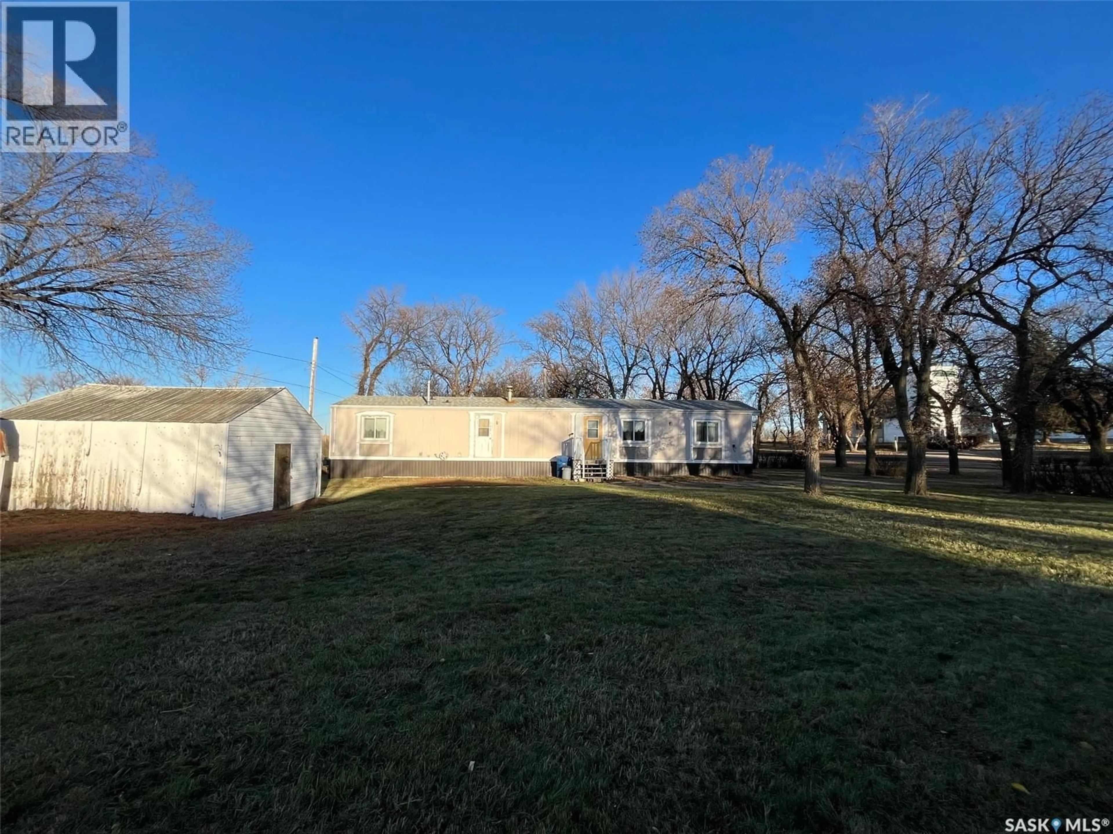 A pic from outside/outdoor area/front of a property/back of a property/a pic from drone, unknown for E - 118 2 AVENUE, Lafleche Saskatchewan S0H2K0