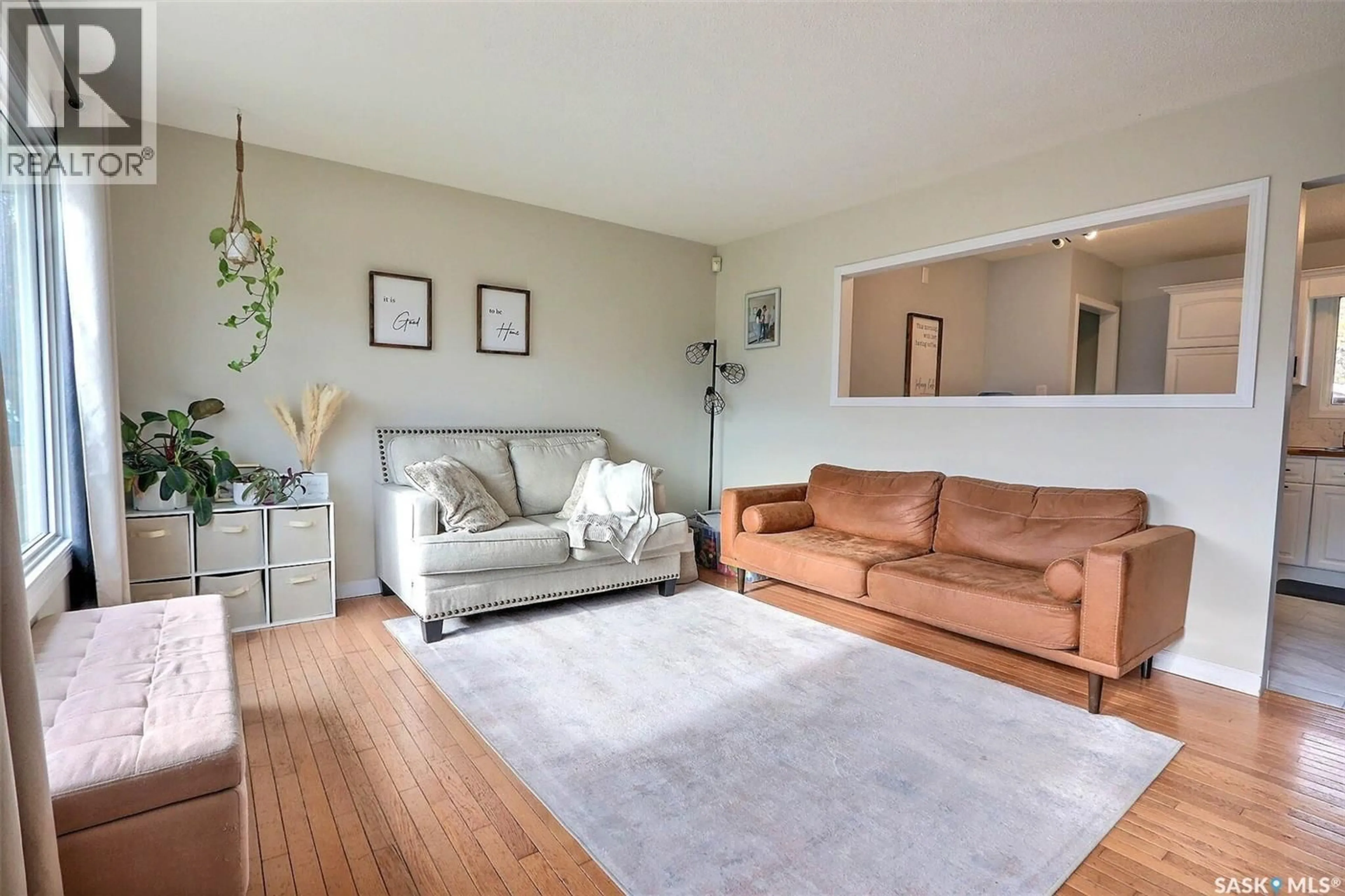 Living room with furniture, wood/laminate floor for 1052 4TH STREET, Prince Albert Saskatchewan S6V0K9