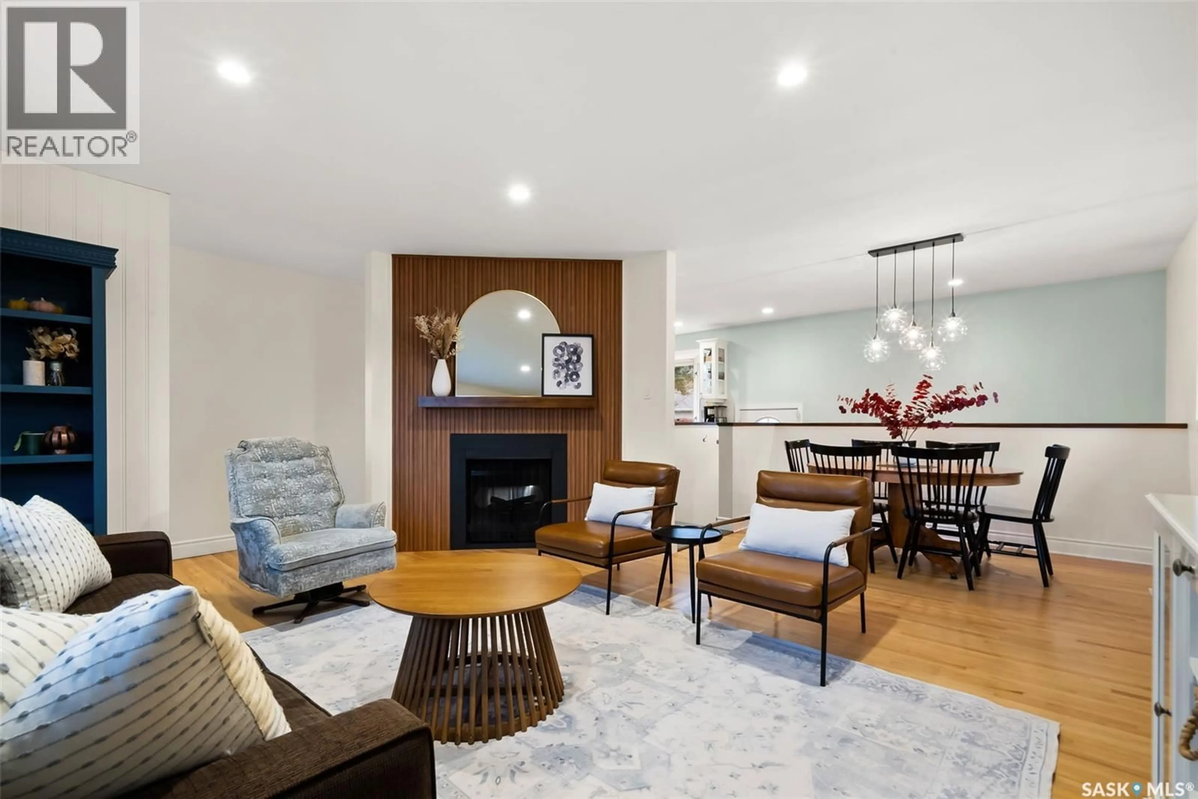 Living room with furniture, wood/laminate floor for 74 HAULTAIN CRESCENT, Regina Saskatchewan S4S4B5