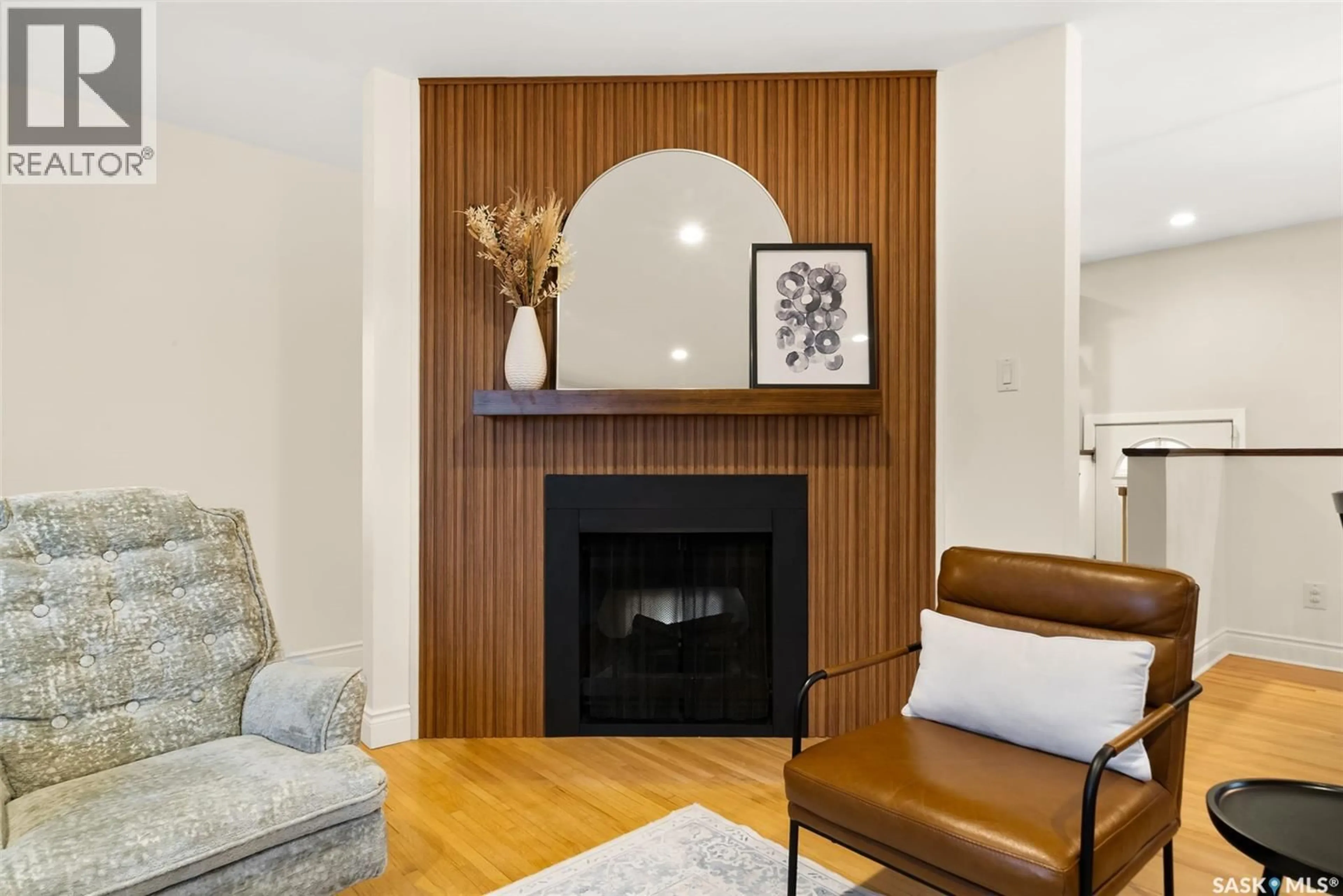 Living room with furniture, wood/laminate floor for 74 HAULTAIN CRESCENT, Regina Saskatchewan S4S4B5