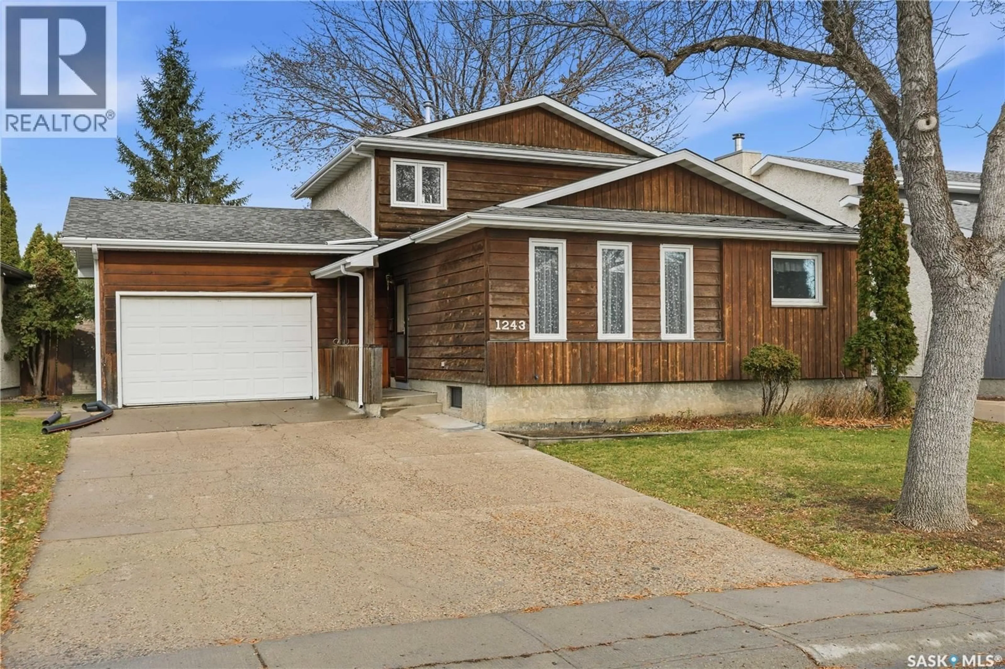 Home with vinyl exterior material, street for 1243 MCNEILL CRESCENT, Regina Saskatchewan S4N5Z3