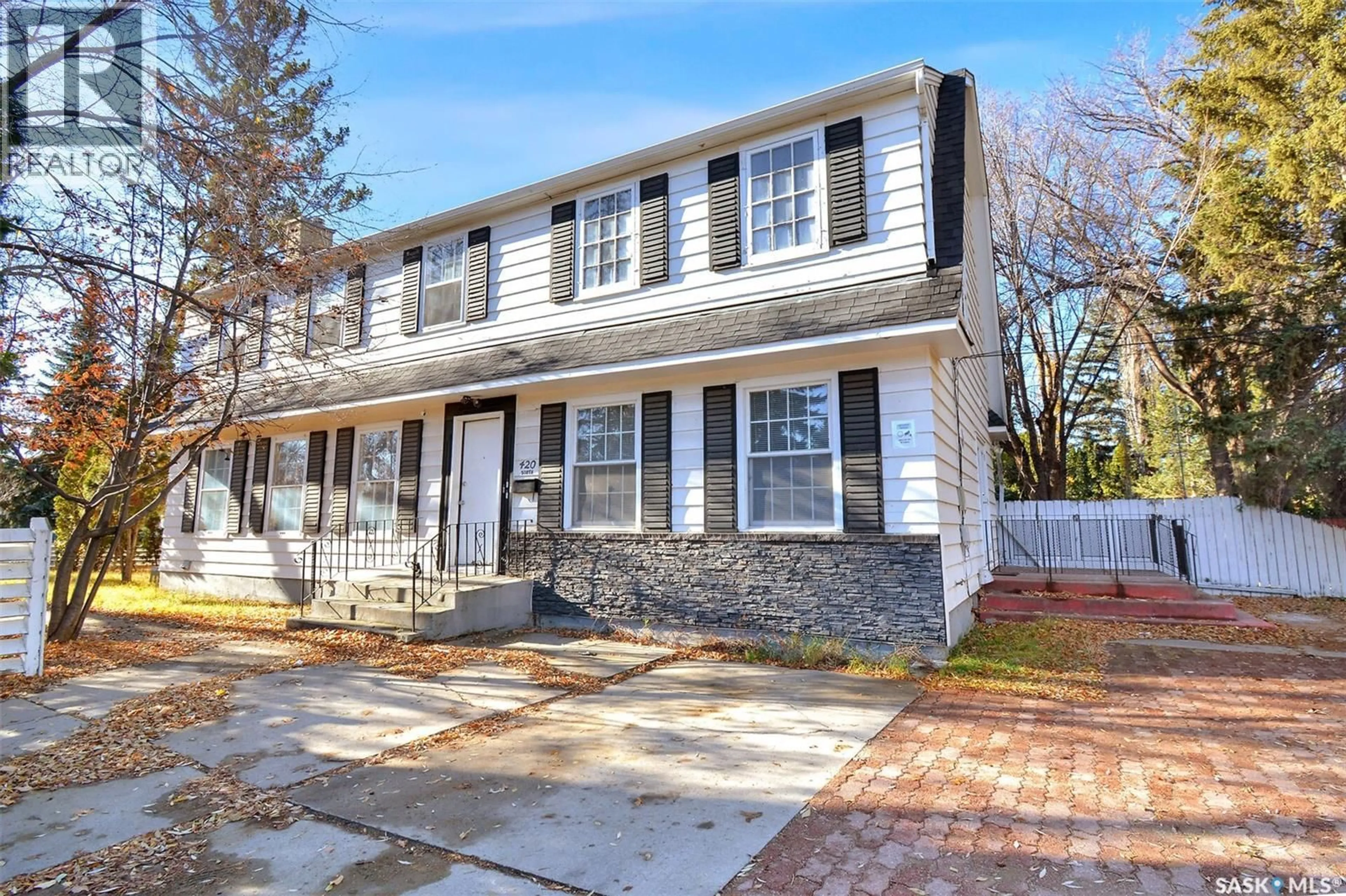 Home with brick exterior material, street for 420 CUMBERLAND AVENUE, Saskatoon Saskatchewan S7N1L5