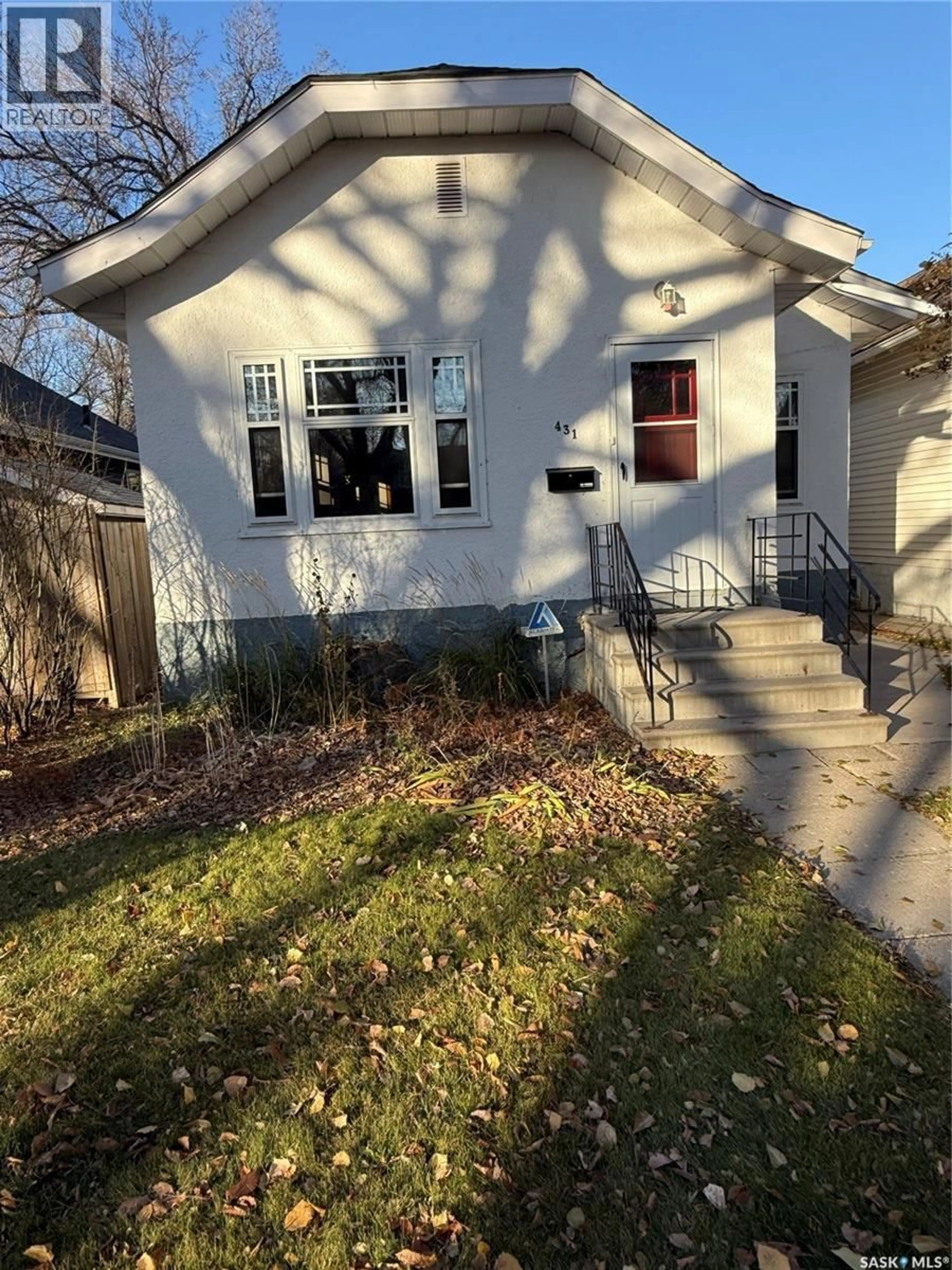 Home with vinyl exterior material, street for 431 6TH STREET, Saskatoon Saskatchewan S7H1B7