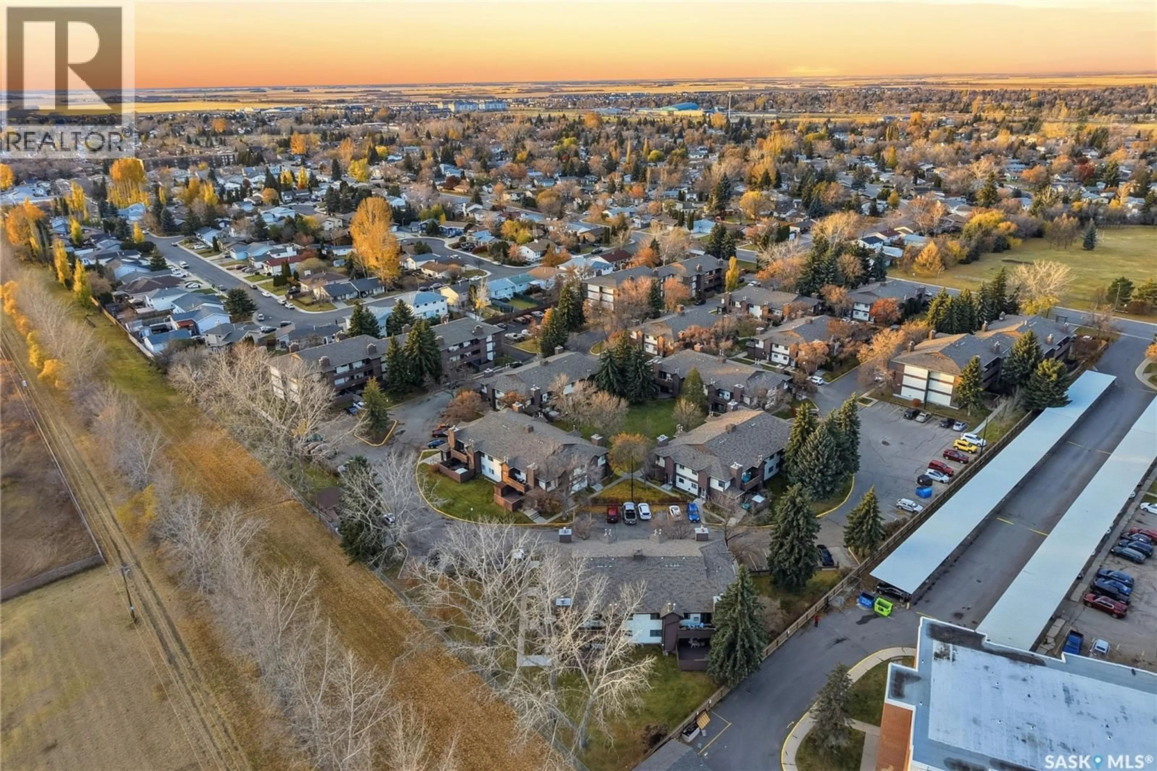 A pic from outside/outdoor area/front of a property/back of a property/a pic from drone, unknown for 203 - 447 PENDYGRASSE ROAD, Saskatoon Saskatchewan S7M5C1