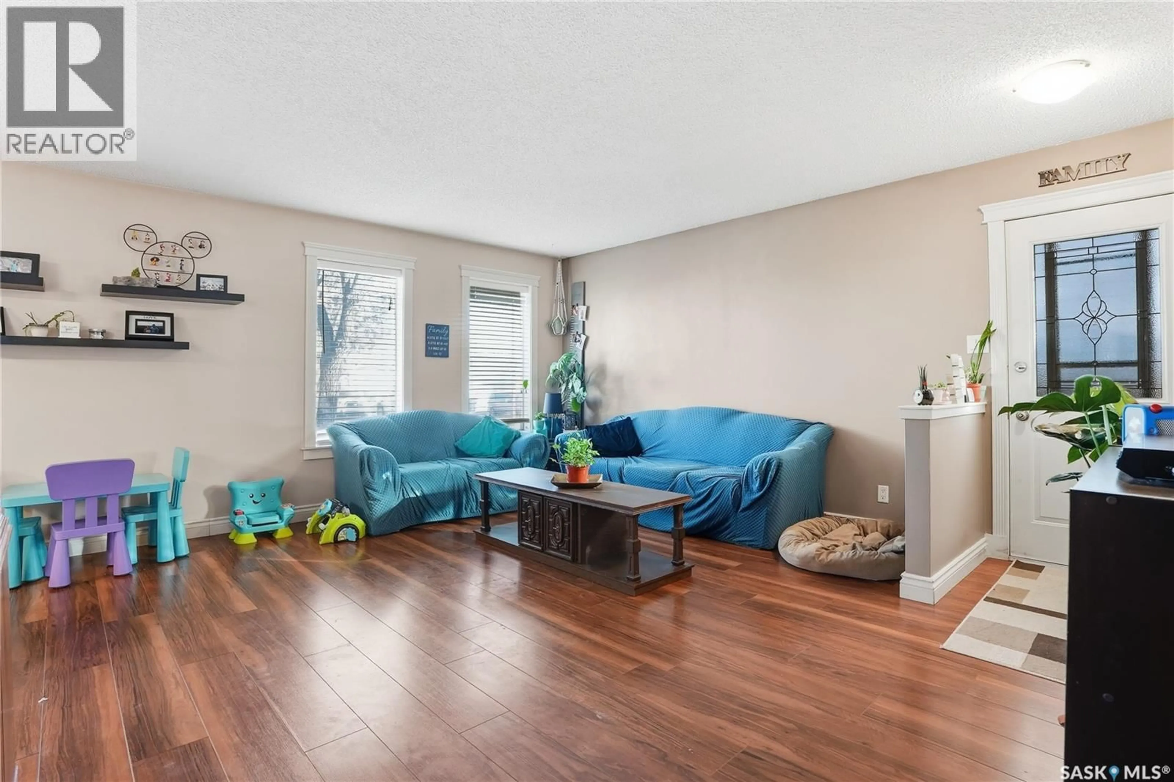 Living room with furniture, wood/laminate floor for 223 MAIN STREET, Warman Saskatchewan S0K4S0