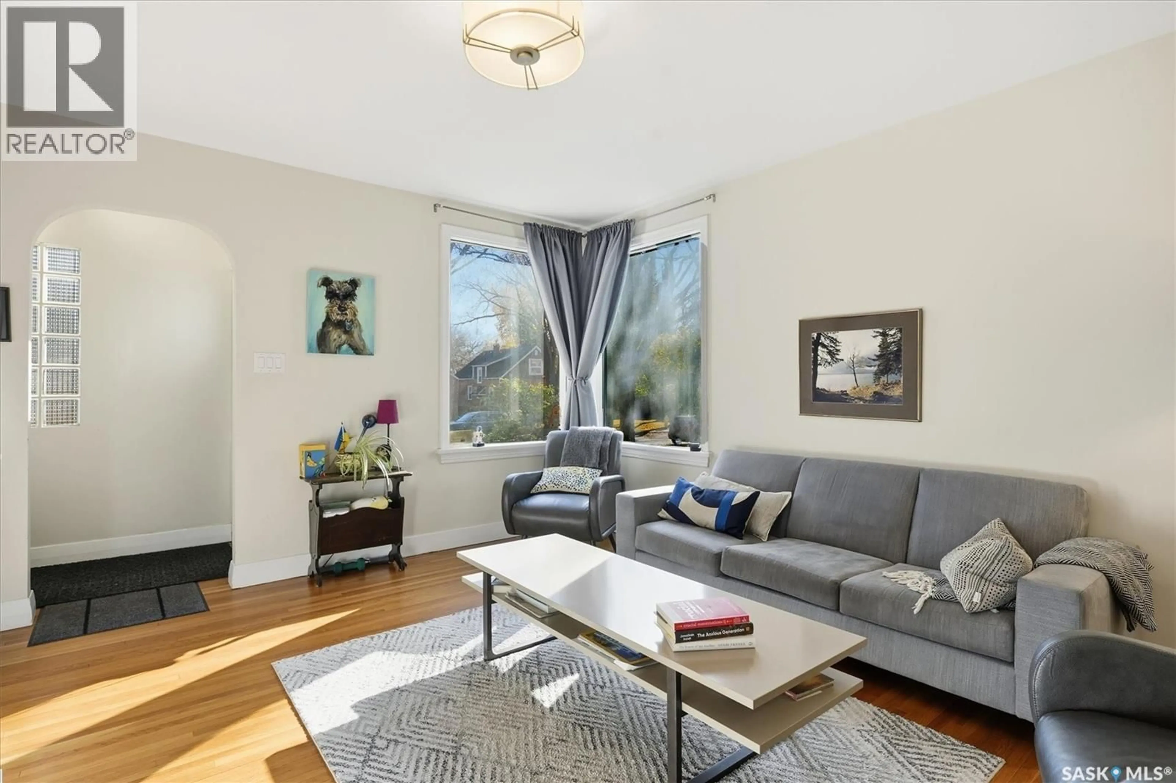 Living room with furniture, wood/laminate floor for 1212 CAIRNS AVENUE, Saskatoon Saskatchewan S7H2H2