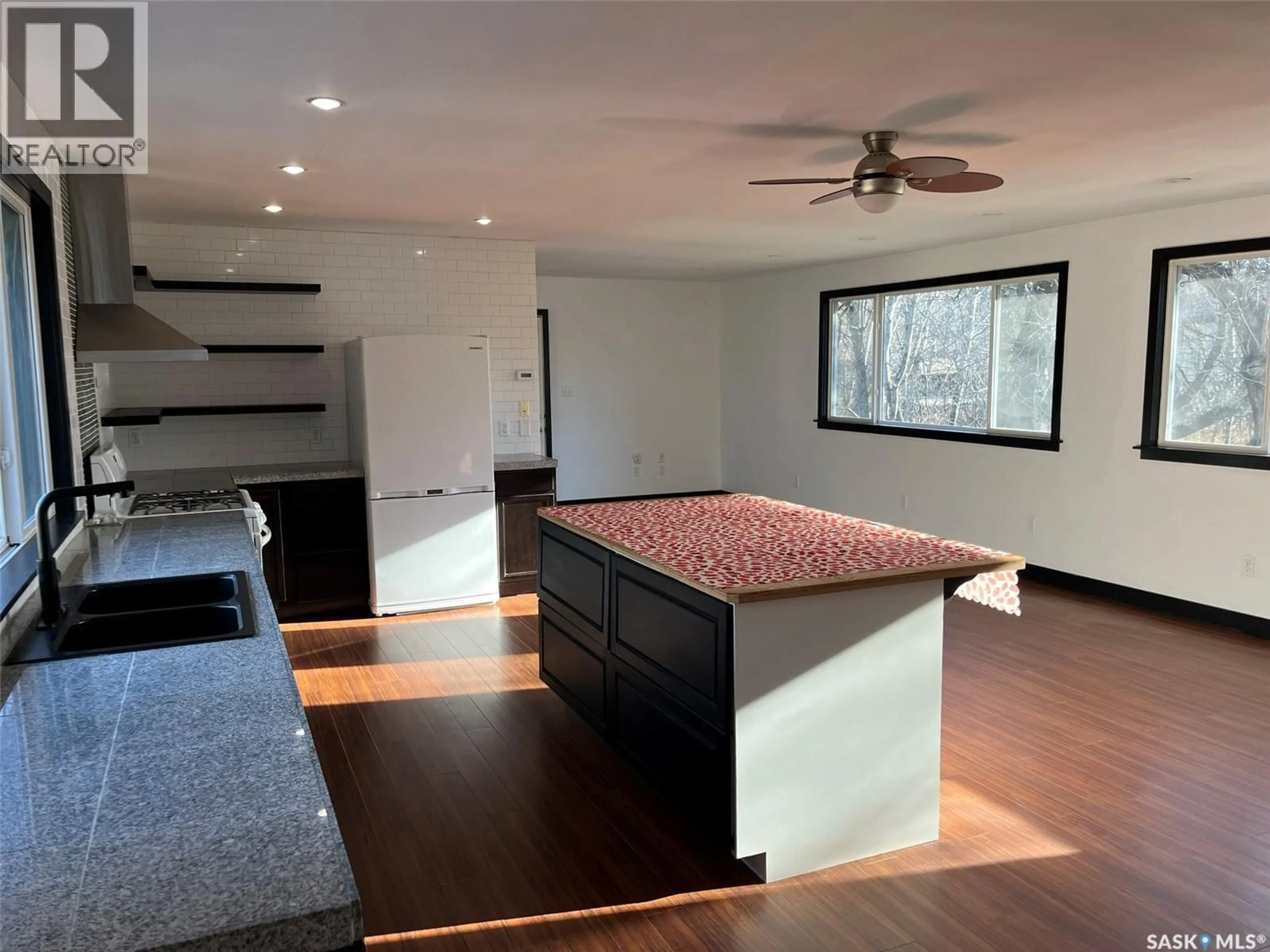 Open concept kitchen, wood/laminate floor for 540 13TH STREET, Prince Albert Saskatchewan S6V5R3