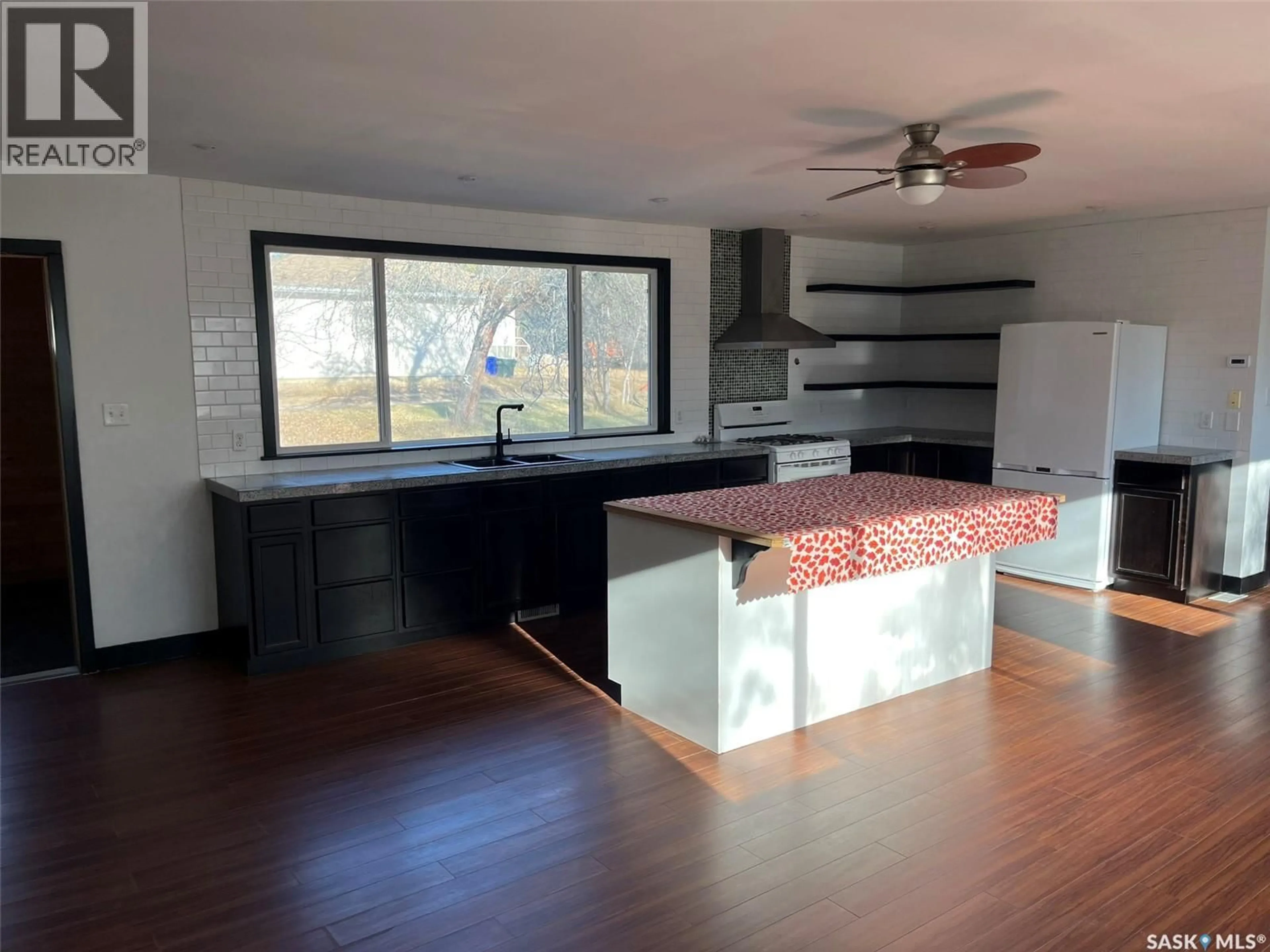 Open concept kitchen, wood/laminate floor for 540 13TH STREET, Prince Albert Saskatchewan S6V5R3