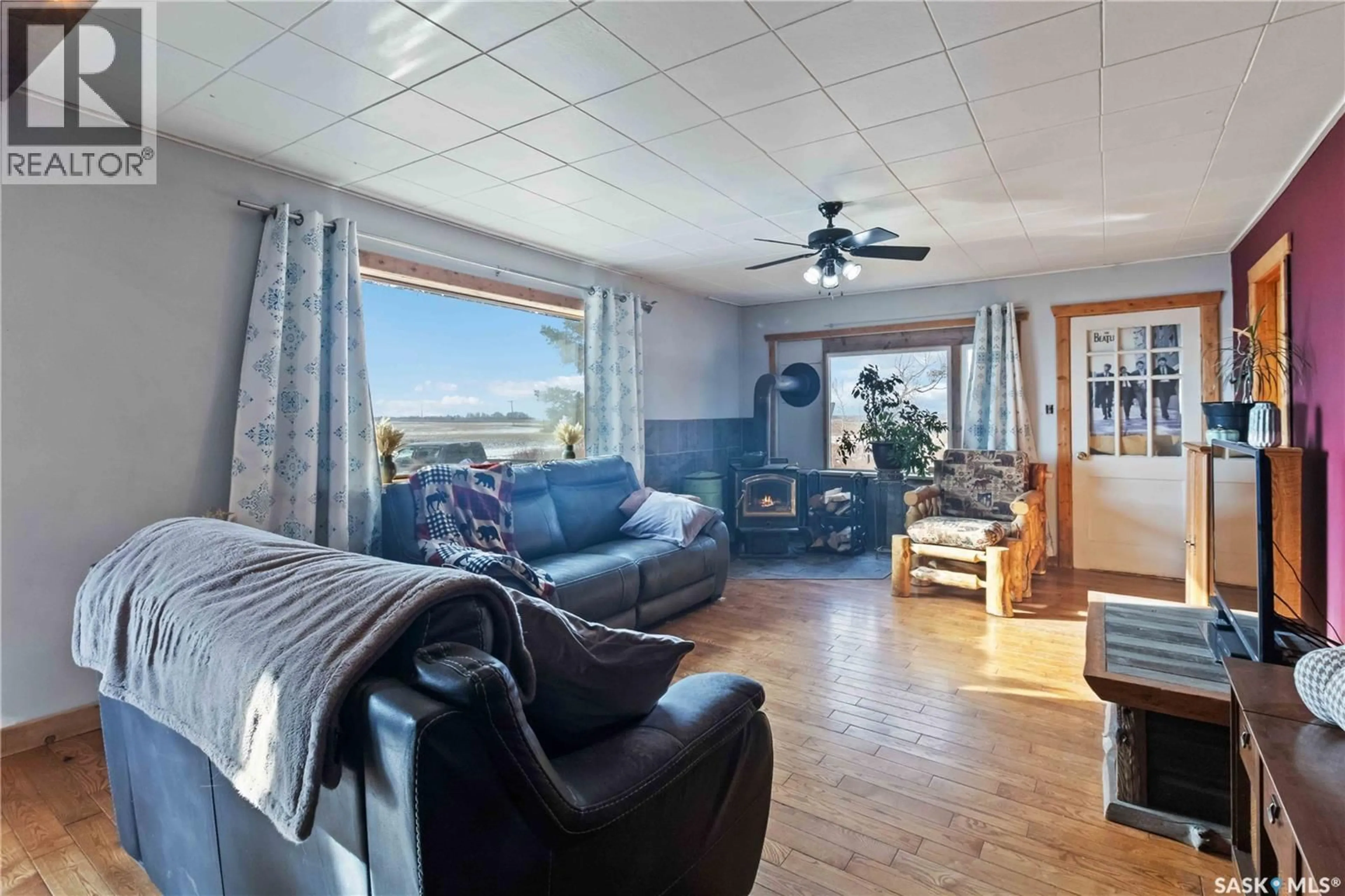 Living room with furniture, wood/laminate floor for NW27 -45-6 W 3rd - 40 HIGHWAY, Blaine Lake Saskatchewan S0J1R0