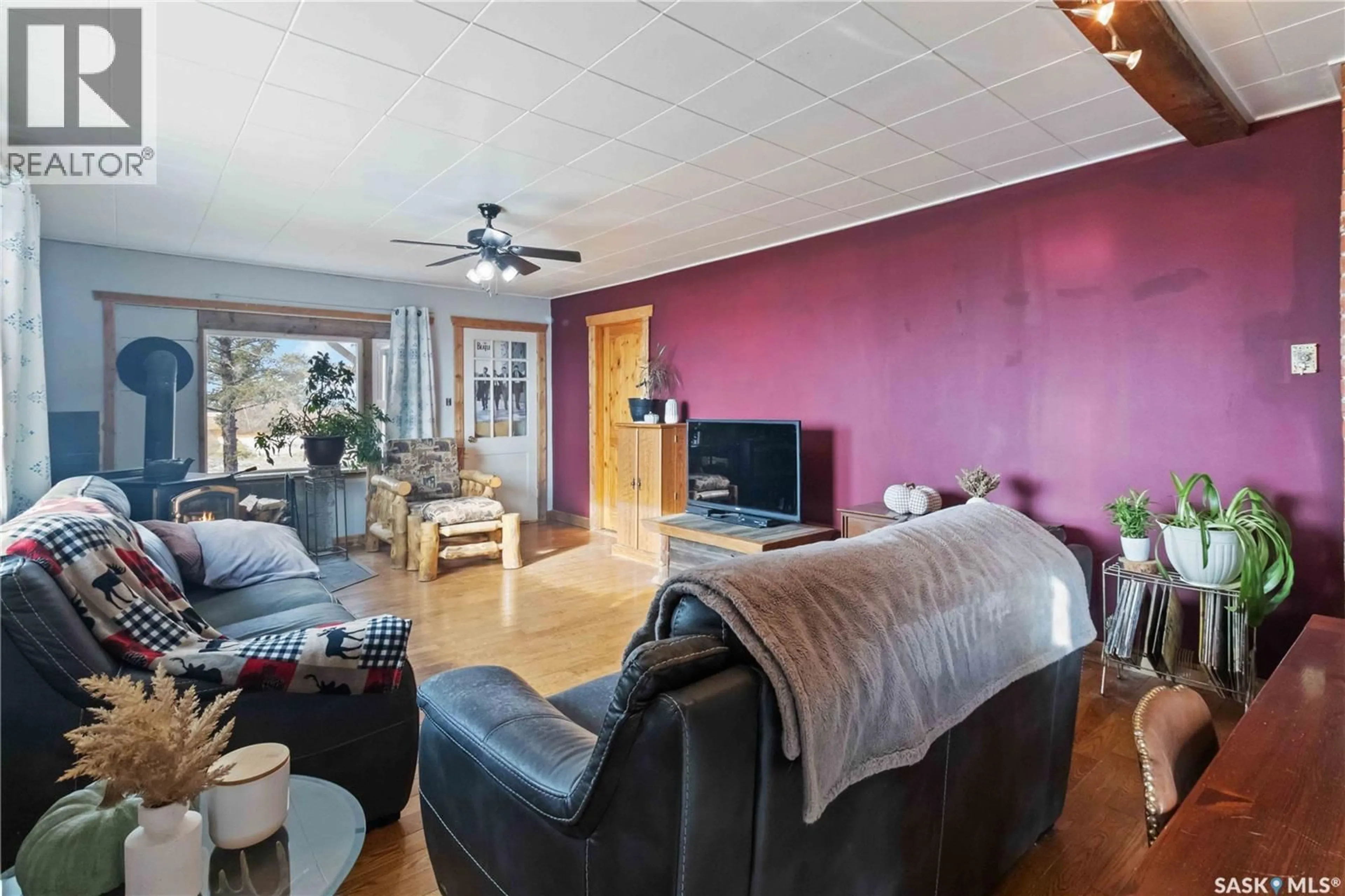 Living room with furniture, wood/laminate floor for NW27 -45-6 W 3rd - 40 HIGHWAY, Blaine Lake Saskatchewan S0J1R0