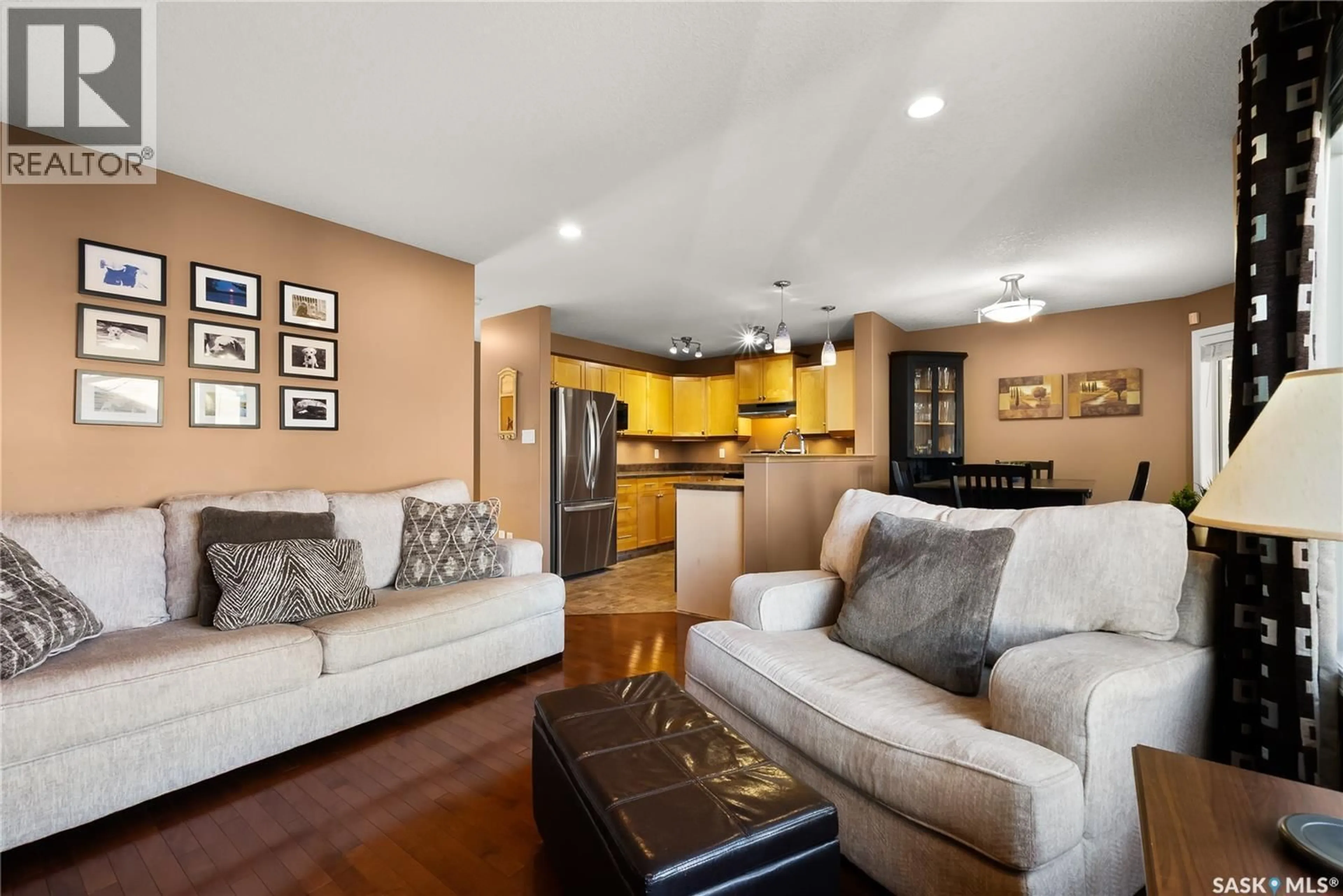 Living room with furniture, wood/laminate floor for 4466 NICURITY DRIVE, Regina Saskatchewan S4X0C3