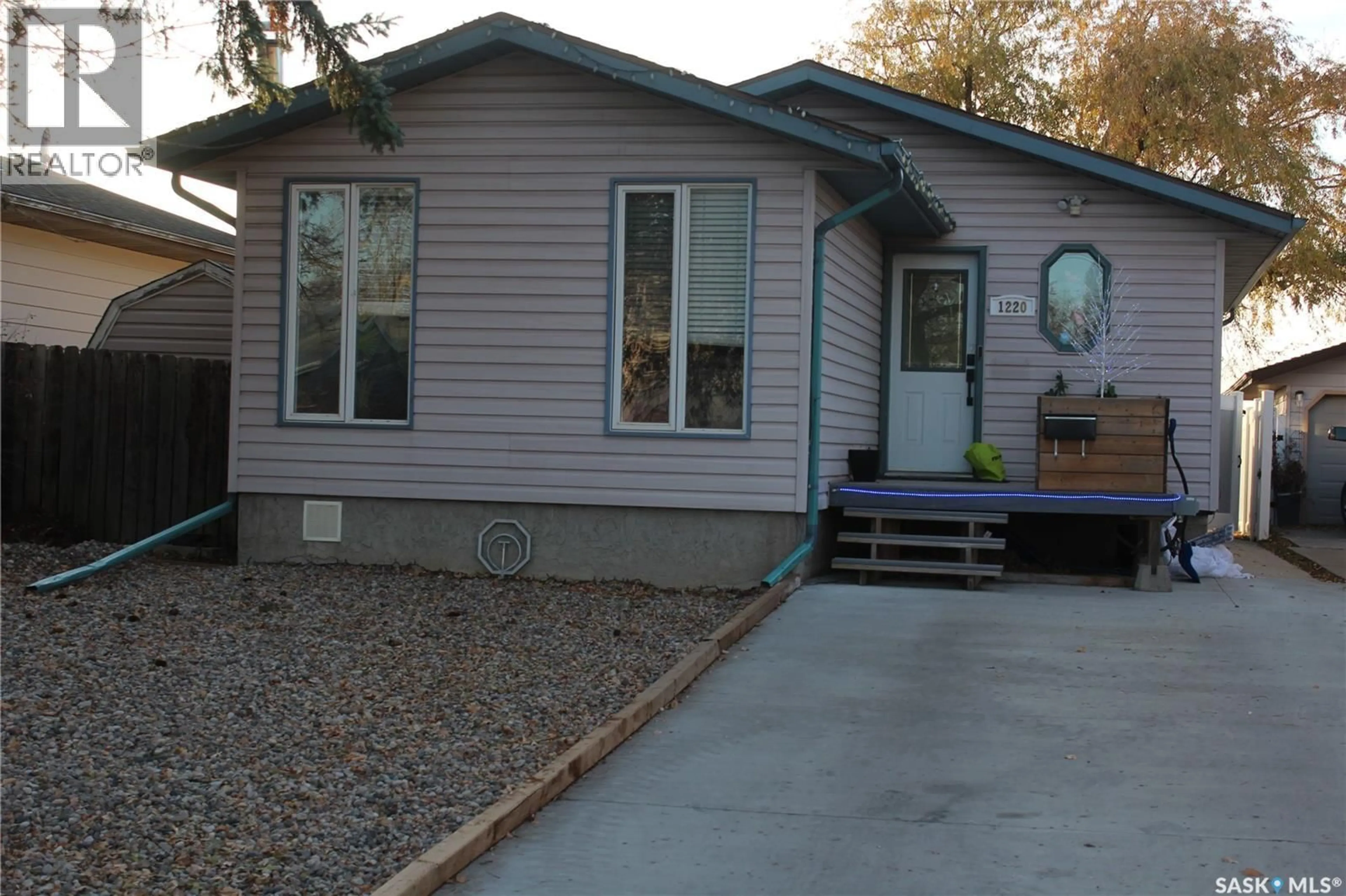 Home with vinyl exterior material, street for 1220 COURTNEY STREET, Regina Saskatchewan S4T7R9