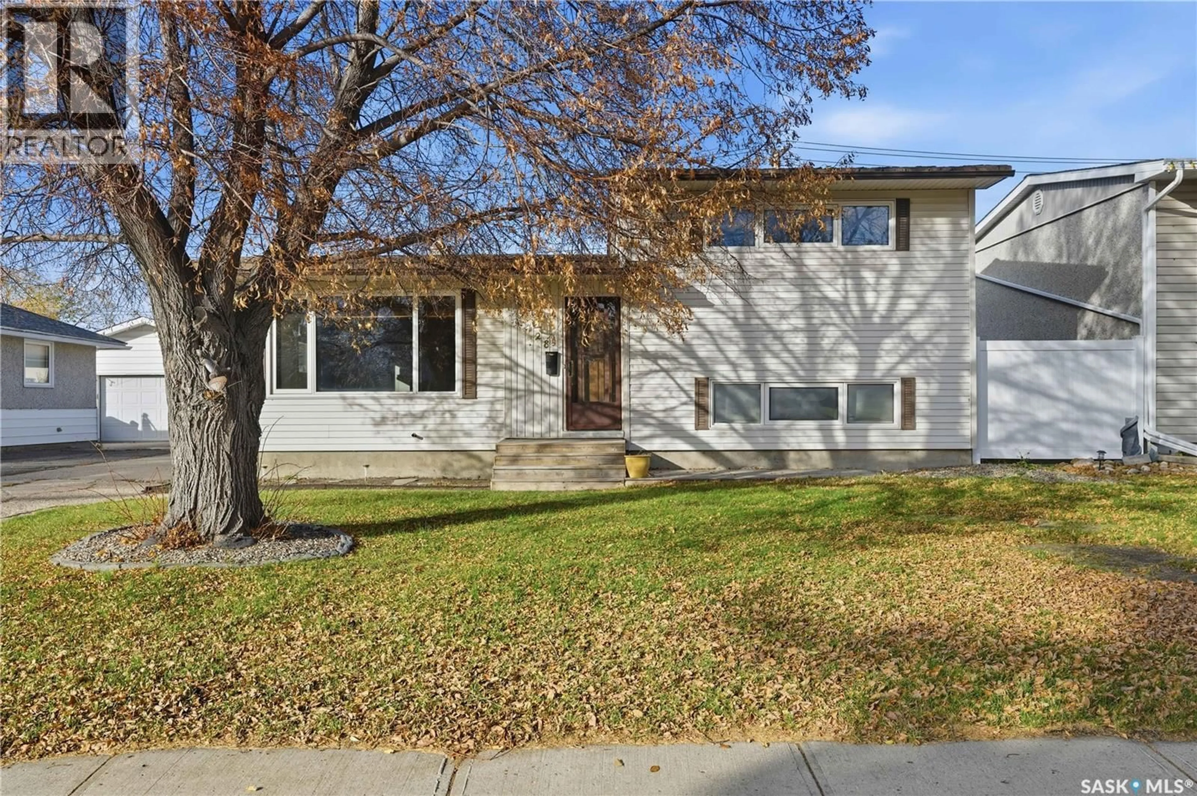 Home with vinyl exterior material, street for 128 YARNTON CRESCENT, Regina Saskatchewan S4R4A3