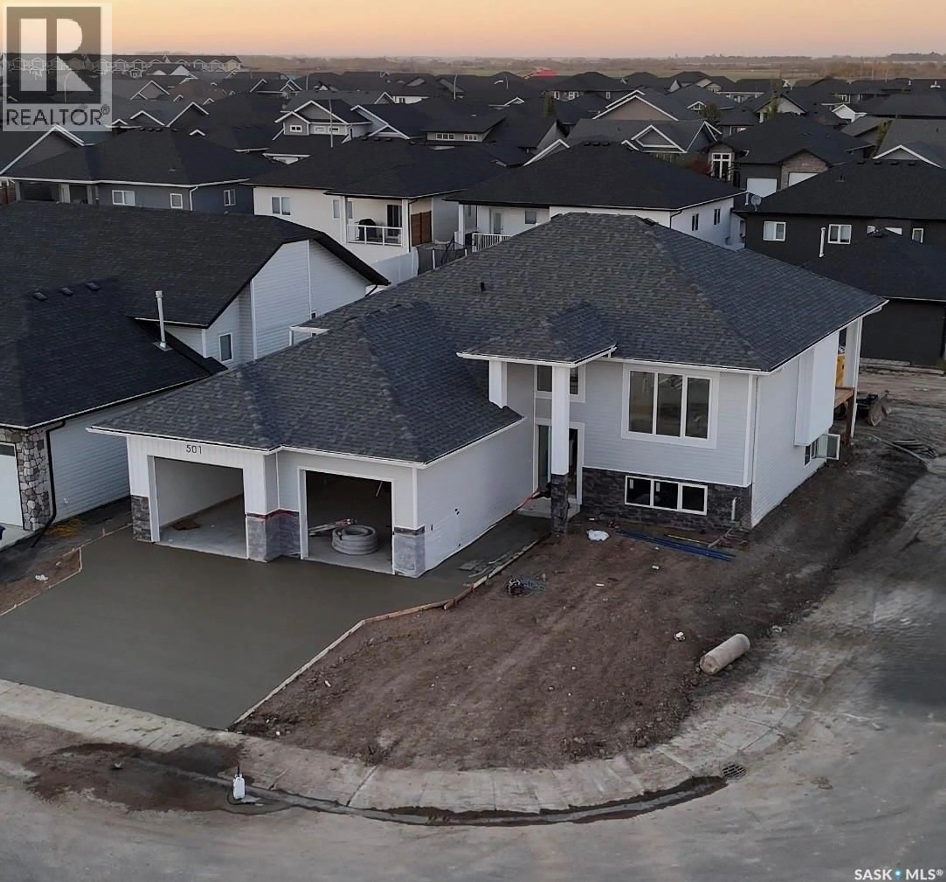 A pic from outside/outdoor area/front of a property/back of a property/a pic from drone, water/lake/river/ocean view for 501 JONES CRESCENT, Warman Saskatchewan S0K4S4