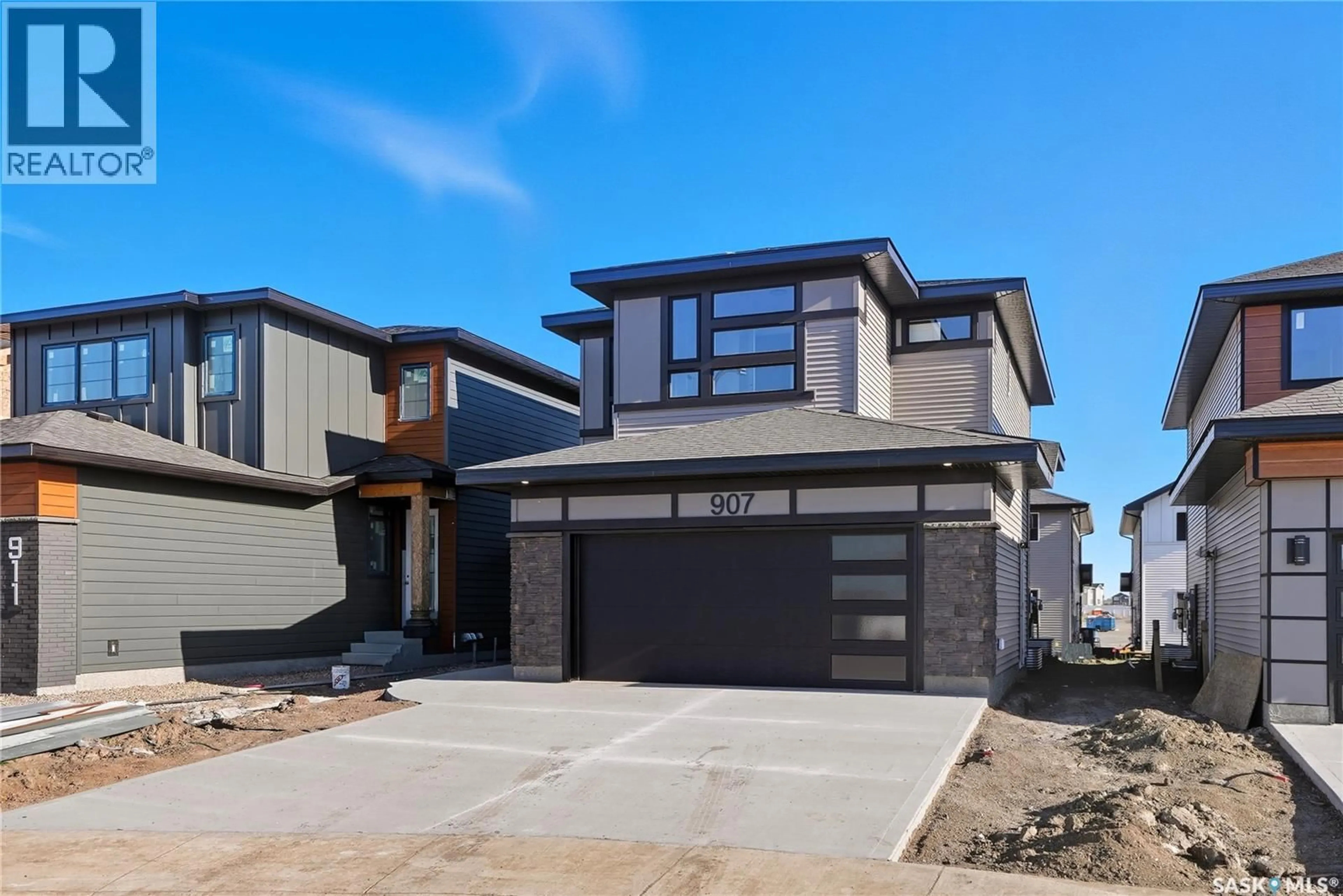 Home with brick exterior material, street for 907 TRAEGER MANOR, Saskatoon Saskatchewan S7V1V8