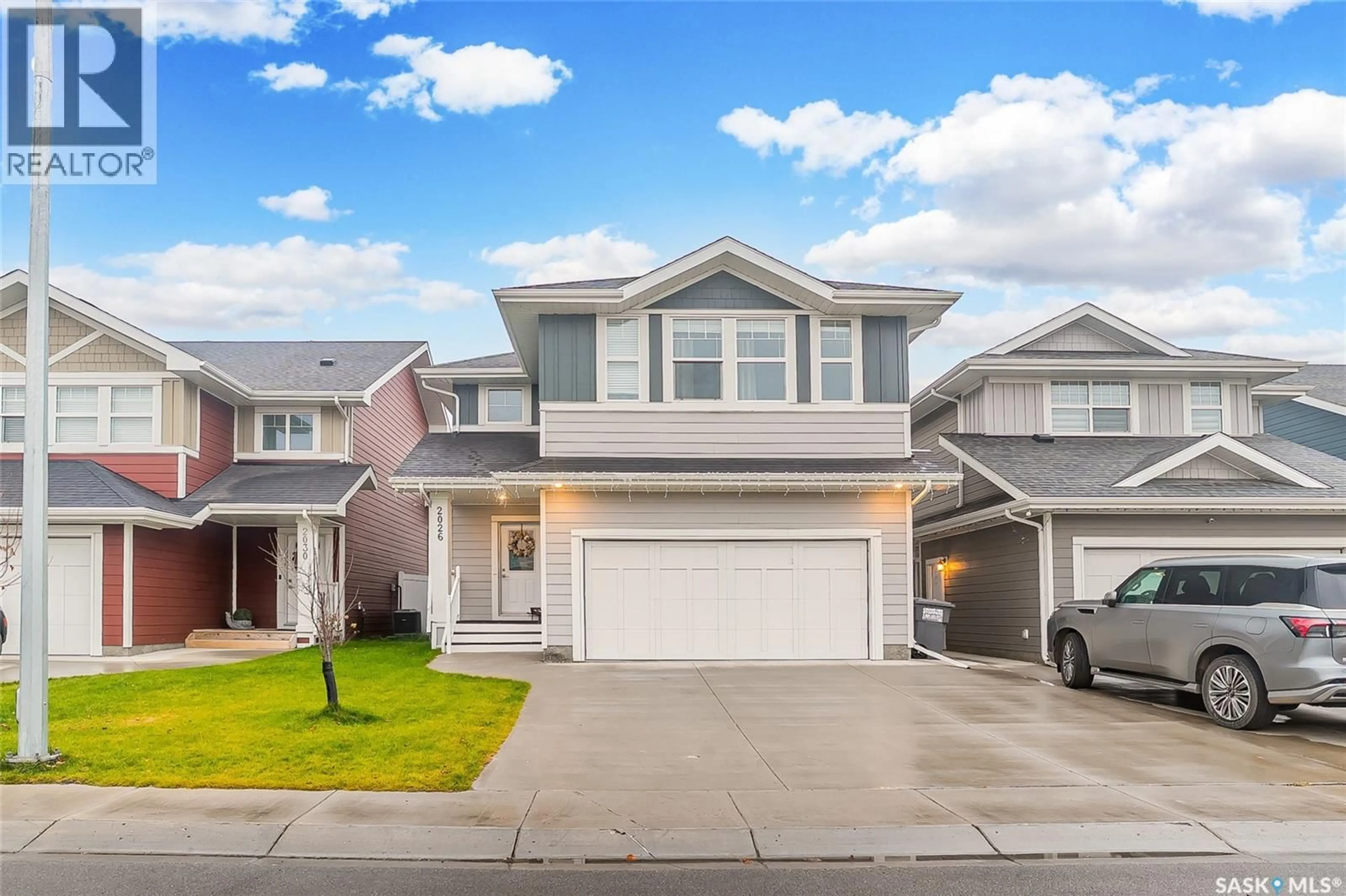 Home with vinyl exterior material, street for 2026 STILLING LANE, Saskatoon Saskatchewan S7V0X1