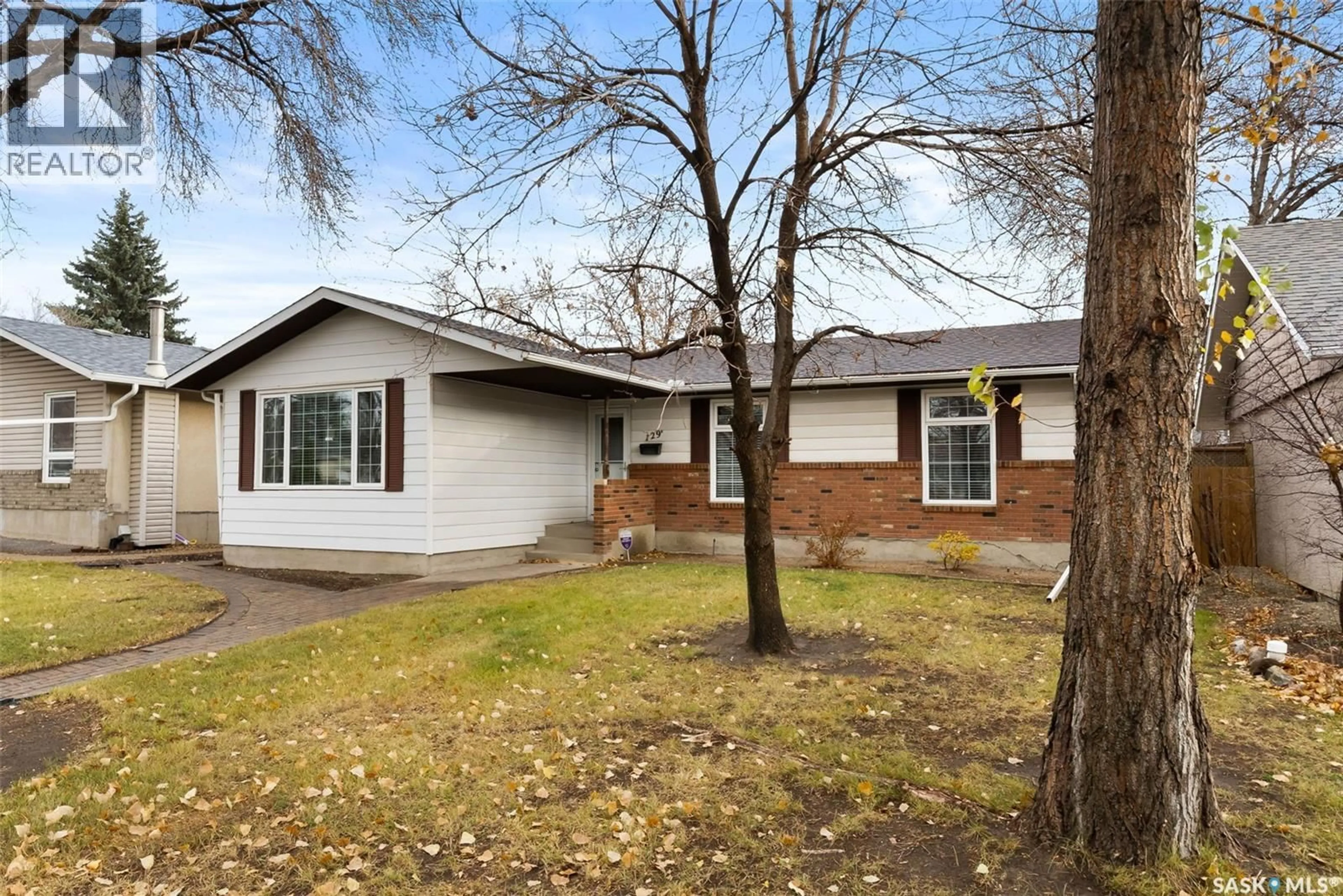 Home with brick exterior material, street for 129 MCCARTHY BOULEVARD, Regina Saskatchewan S4R5S2