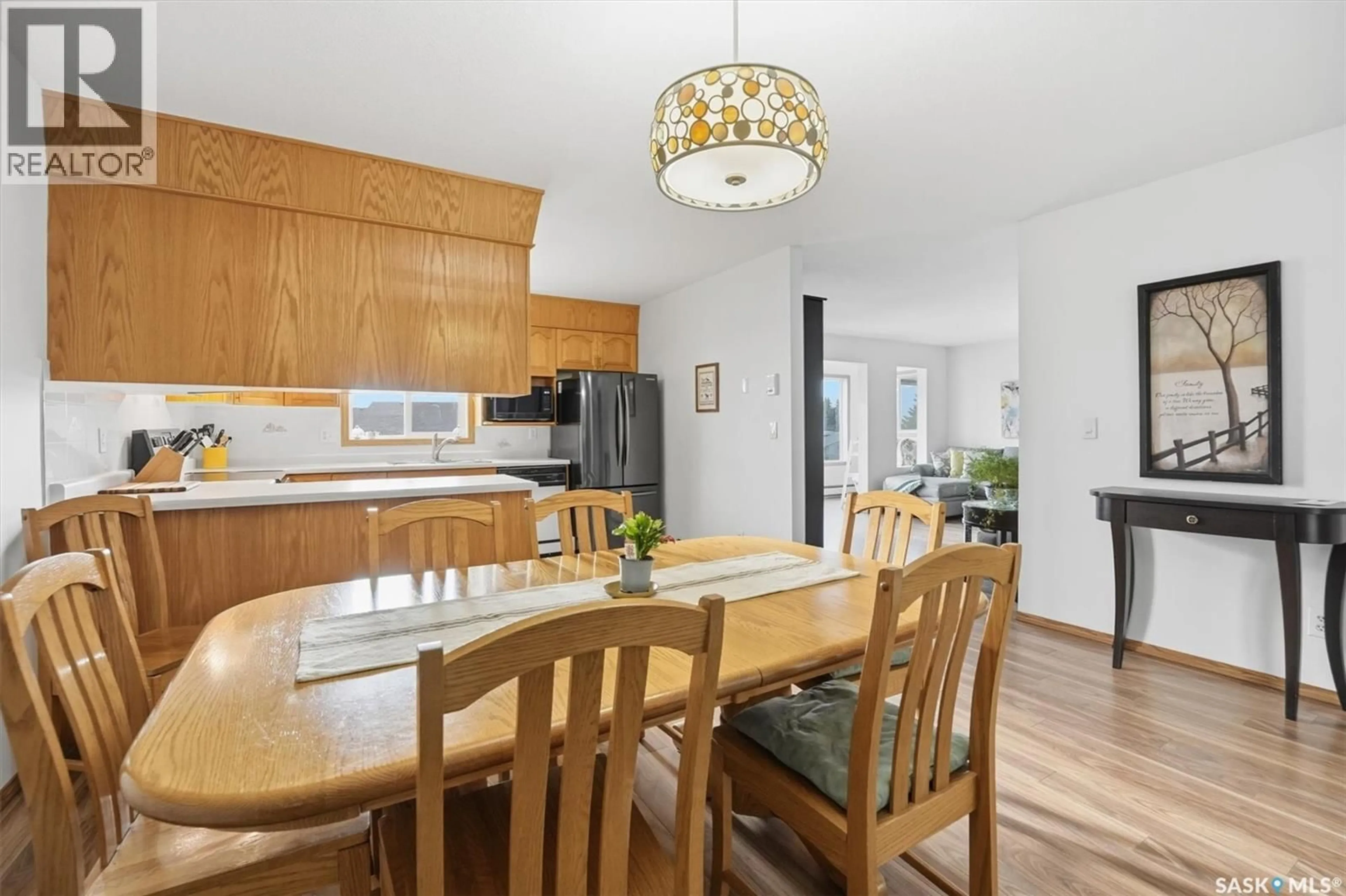 Open concept kitchen, wood/laminate floor for 201 103 KEEVIL CRESCENT, Saskatoon Saskatchewan S7N4L9