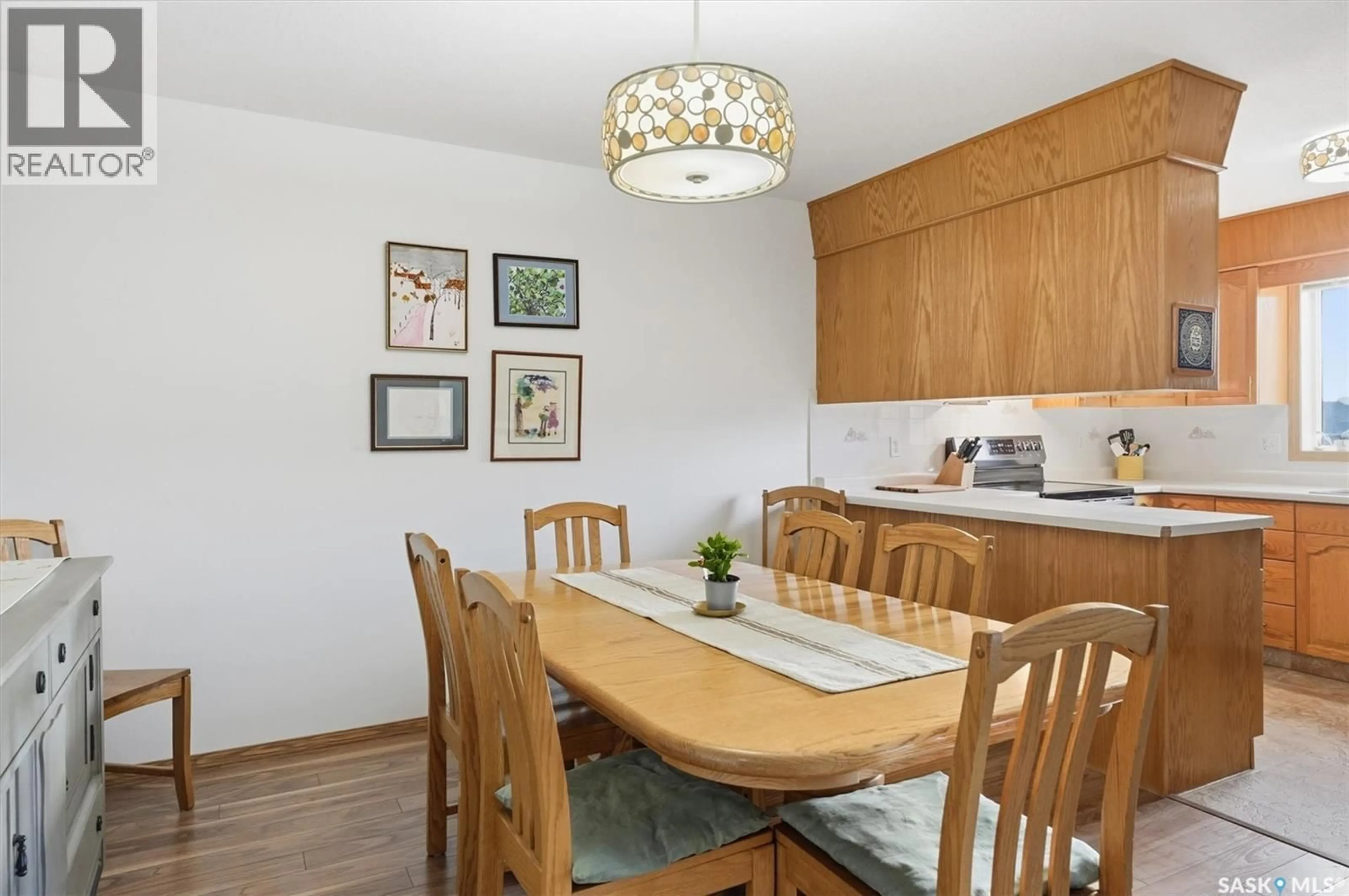 Dining room, wood/laminate floor for 201 103 KEEVIL CRESCENT, Saskatoon Saskatchewan S7N4L9