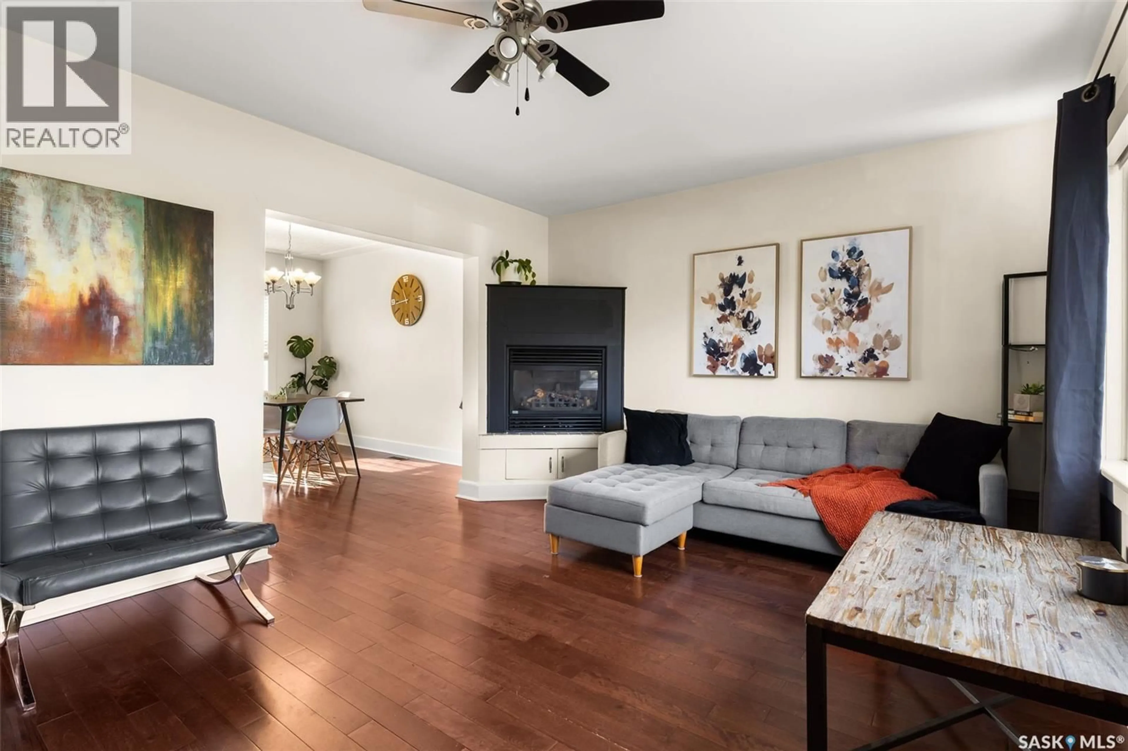 Living room with furniture, wood/laminate floor for 4021 VICTORIA AVENUE, Regina Saskatchewan S4T1M8