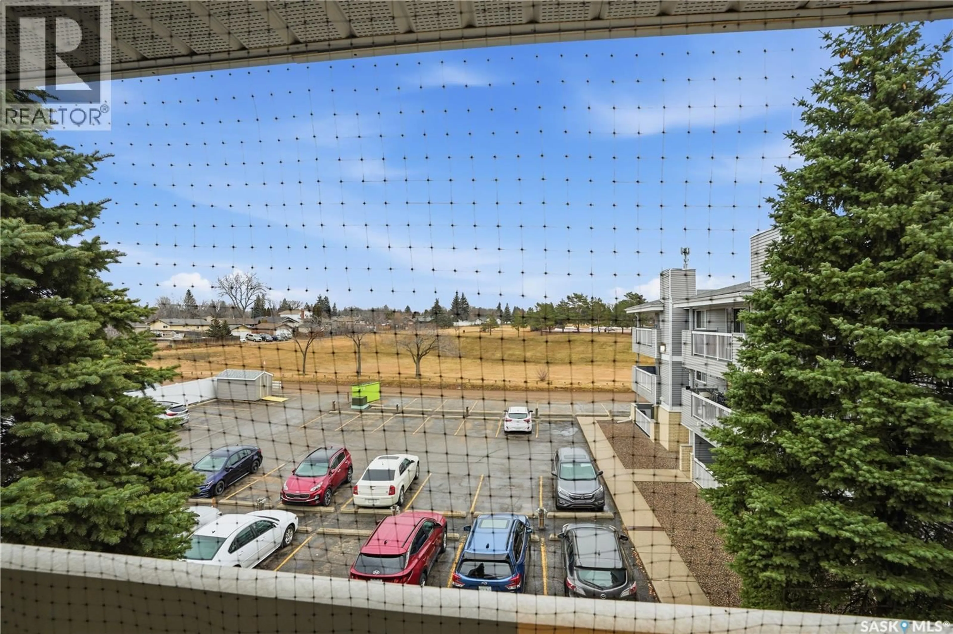 Patio, city buildings view from balcony for 706 - 304 CONFEDERATION DRIVE, Saskatoon Saskatchewan S7L5R7