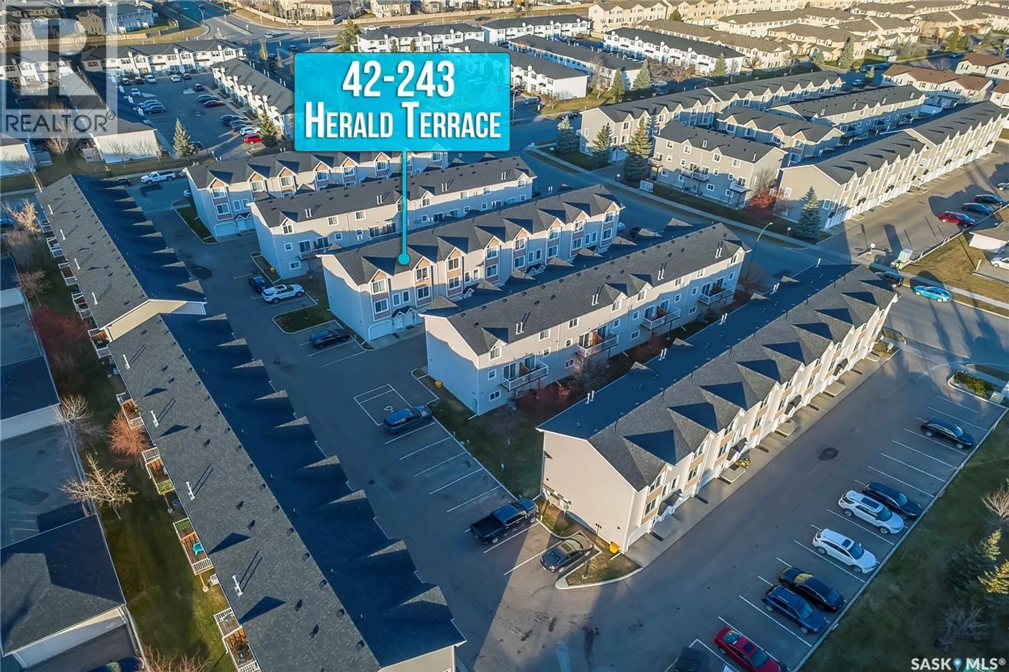 A pic from outside/outdoor area/front of a property/back of a property/a pic from drone, street for 42 243 HEROLD TERRACE, Saskatoon Saskatchewan S7V1J5