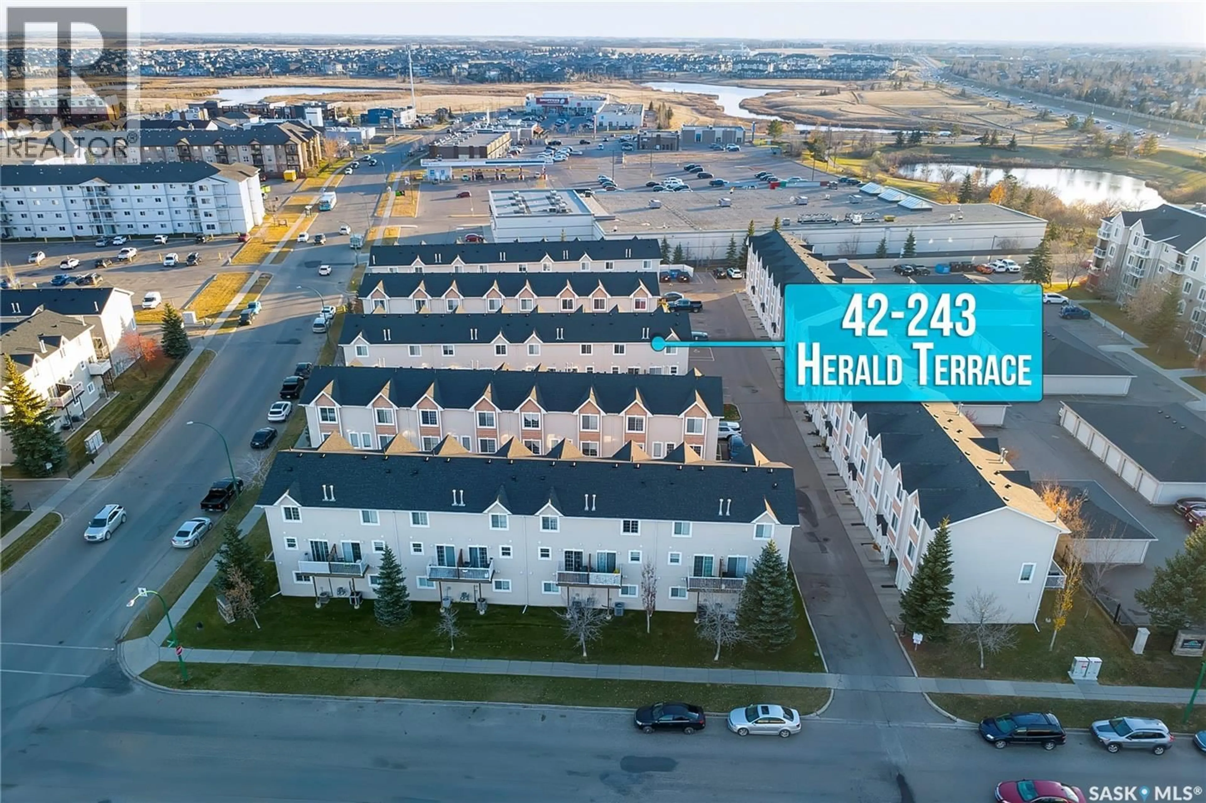 A pic from outside/outdoor area/front of a property/back of a property/a pic from drone, street for 42 243 HEROLD TERRACE, Saskatoon Saskatchewan S7V1J5