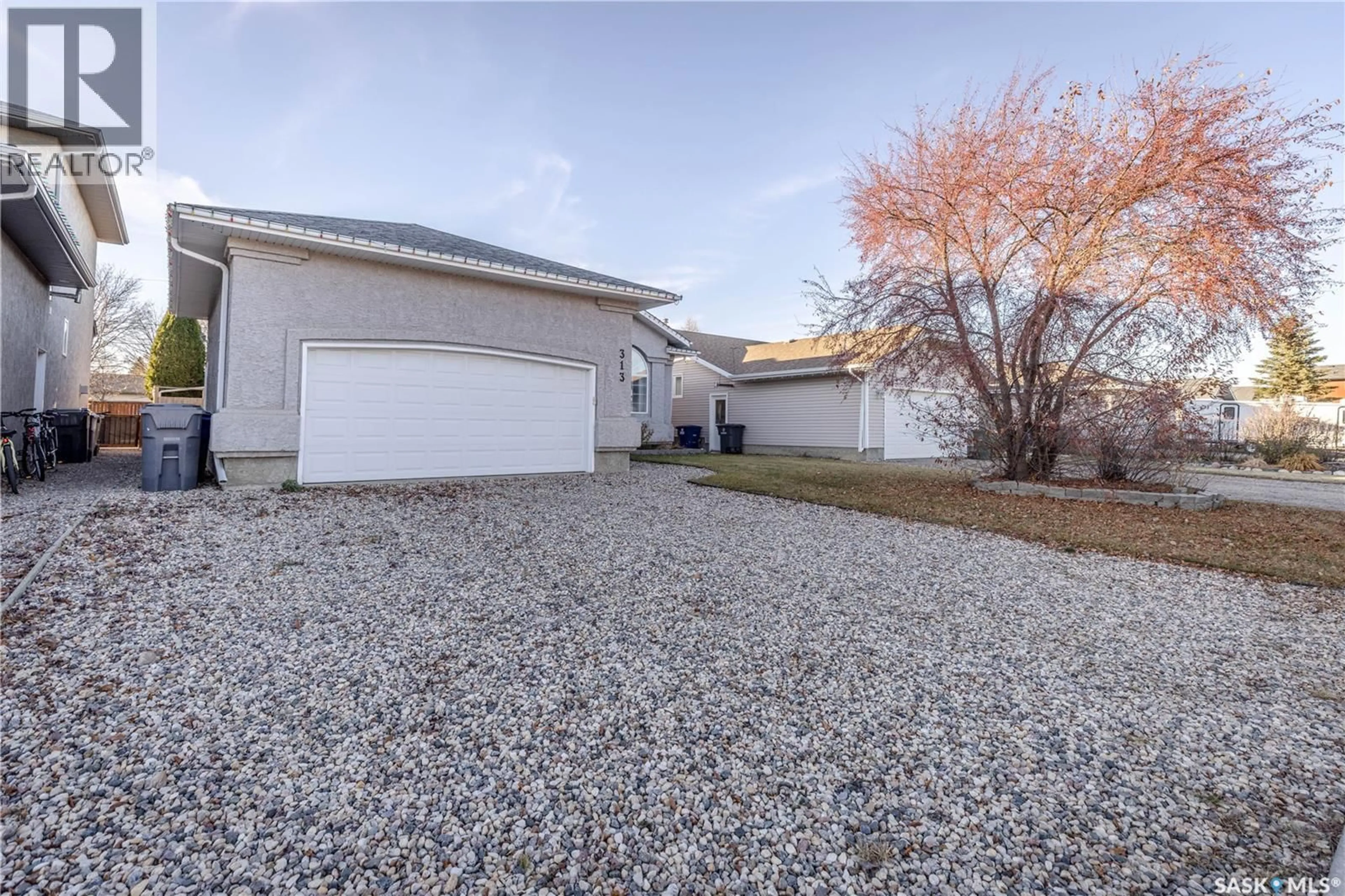 A pic from outside/outdoor area/front of a property/back of a property/a pic from drone, street for 313 VICTOR LANE, Dalmeny Saskatchewan S0K1E0