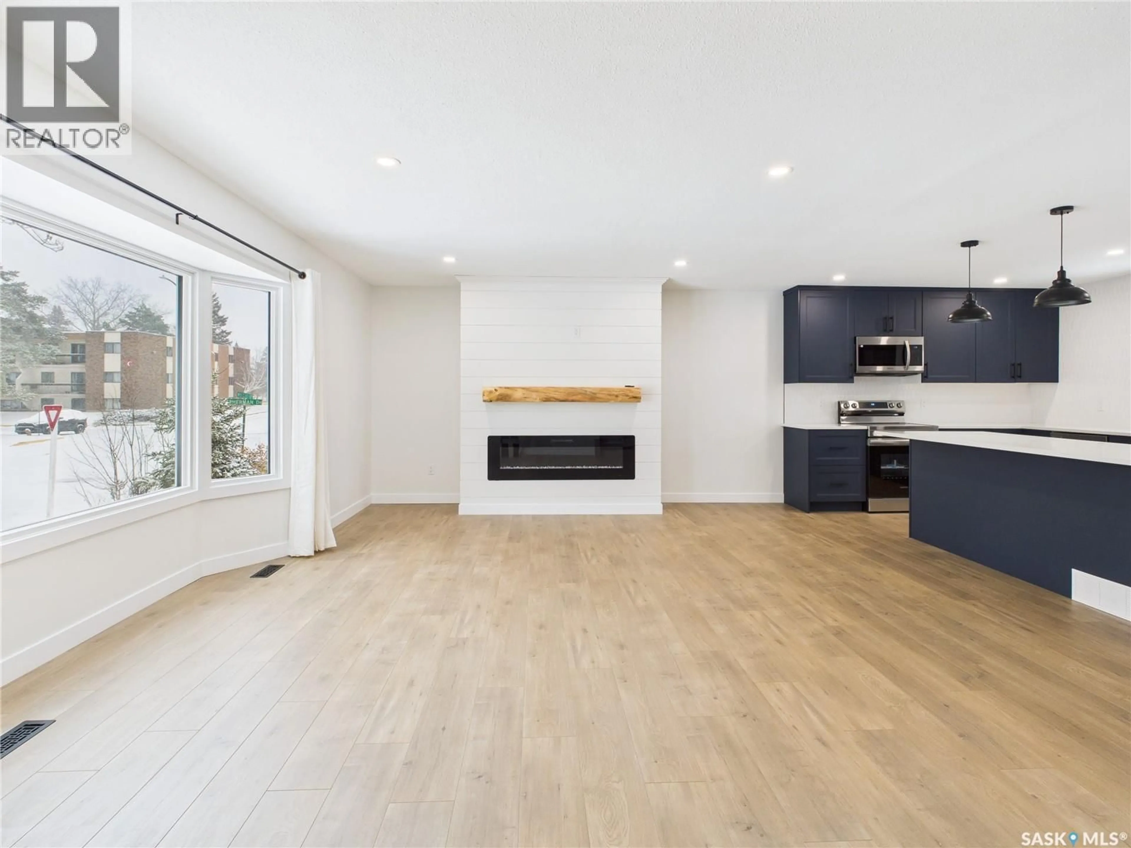 Open concept kitchen, wood/laminate floor for 1199 WYLLIE STREET, Prince Albert Saskatchewan S6V6S3