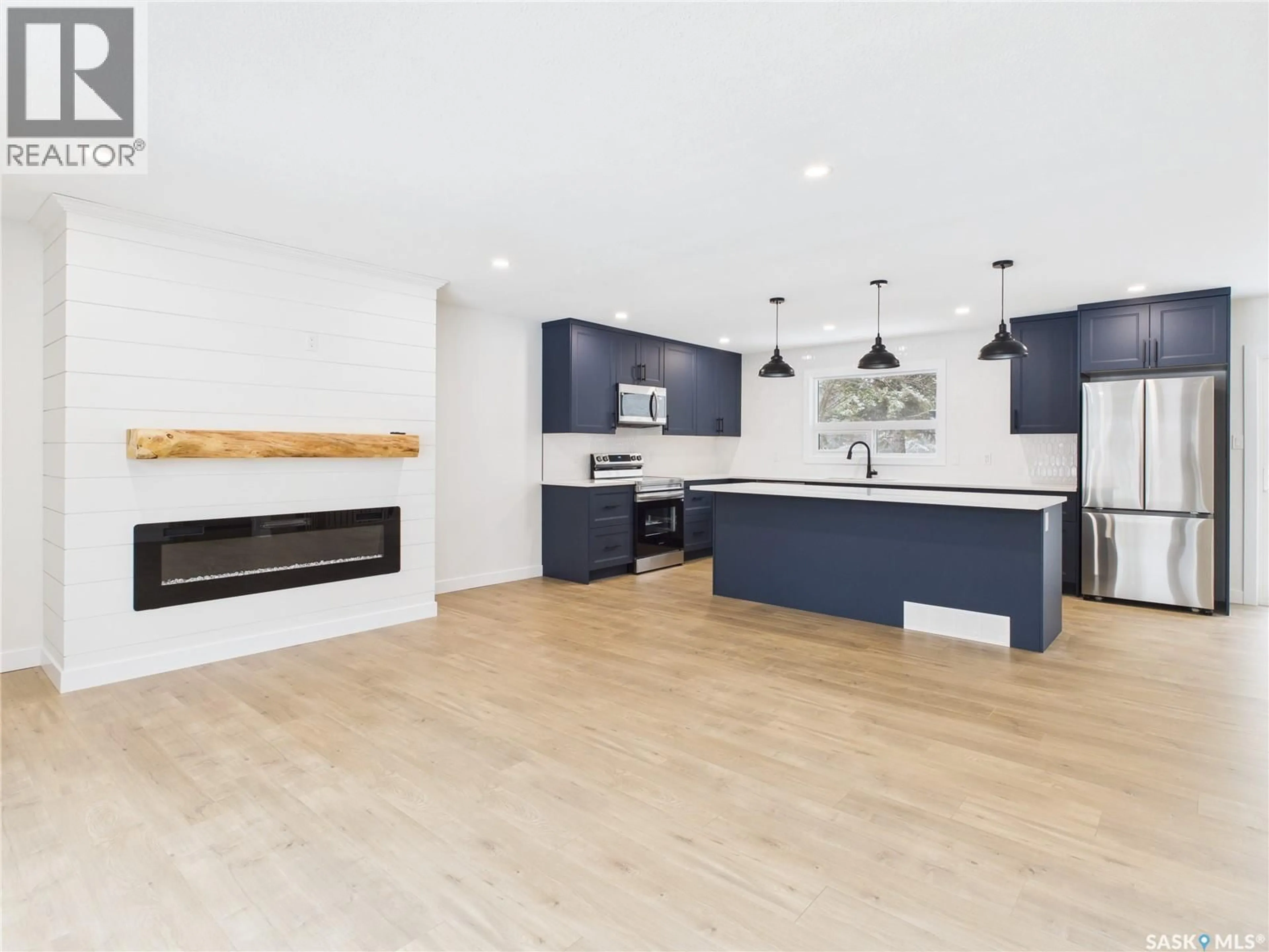 Open concept kitchen, wood/laminate floor for 1199 WYLLIE STREET, Prince Albert Saskatchewan S6V6S3