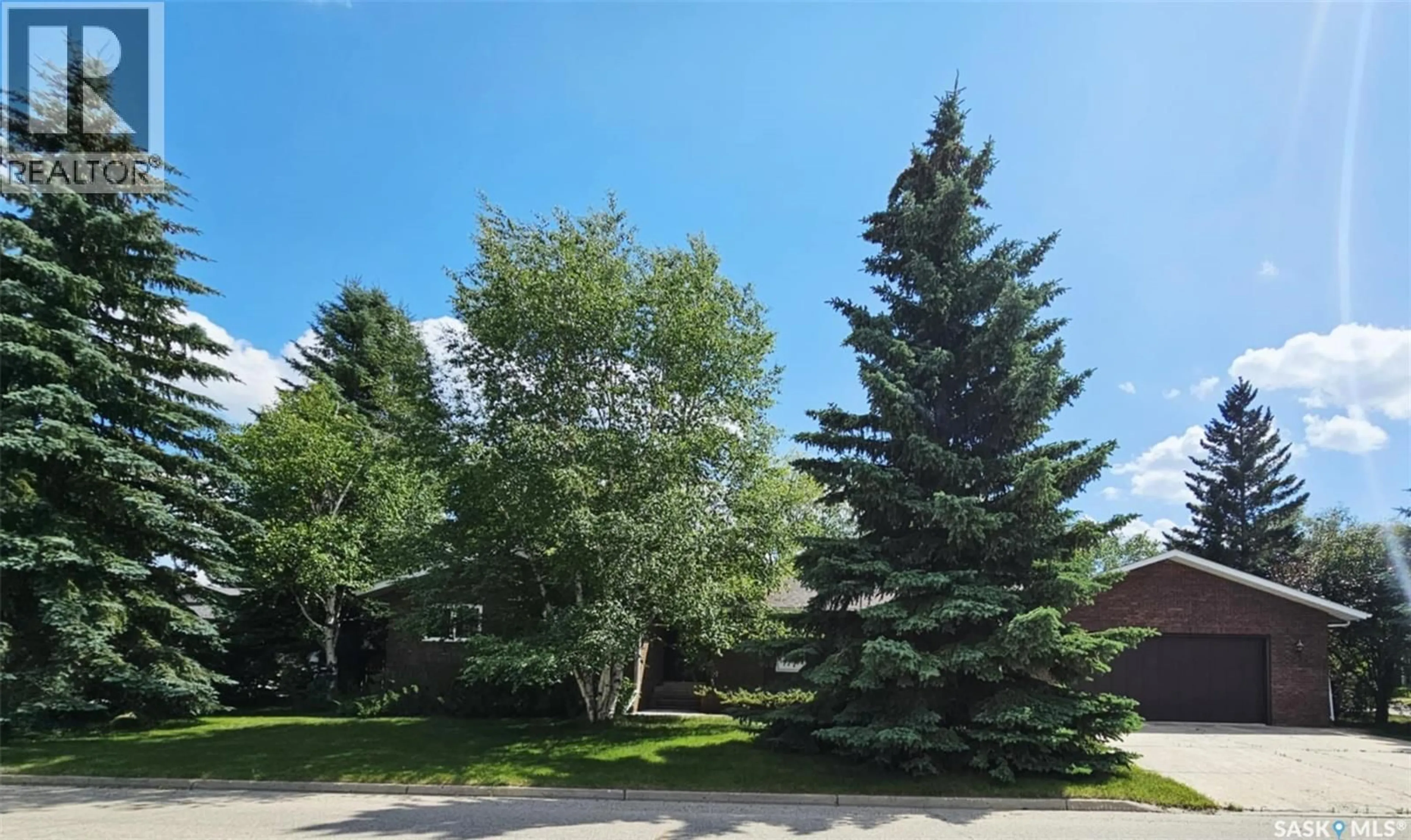 A pic from outside/outdoor area/front of a property/back of a property/a pic from drone, forest/trees view for 515 GRANT BAY, Esterhazy Saskatchewan S0A0X0