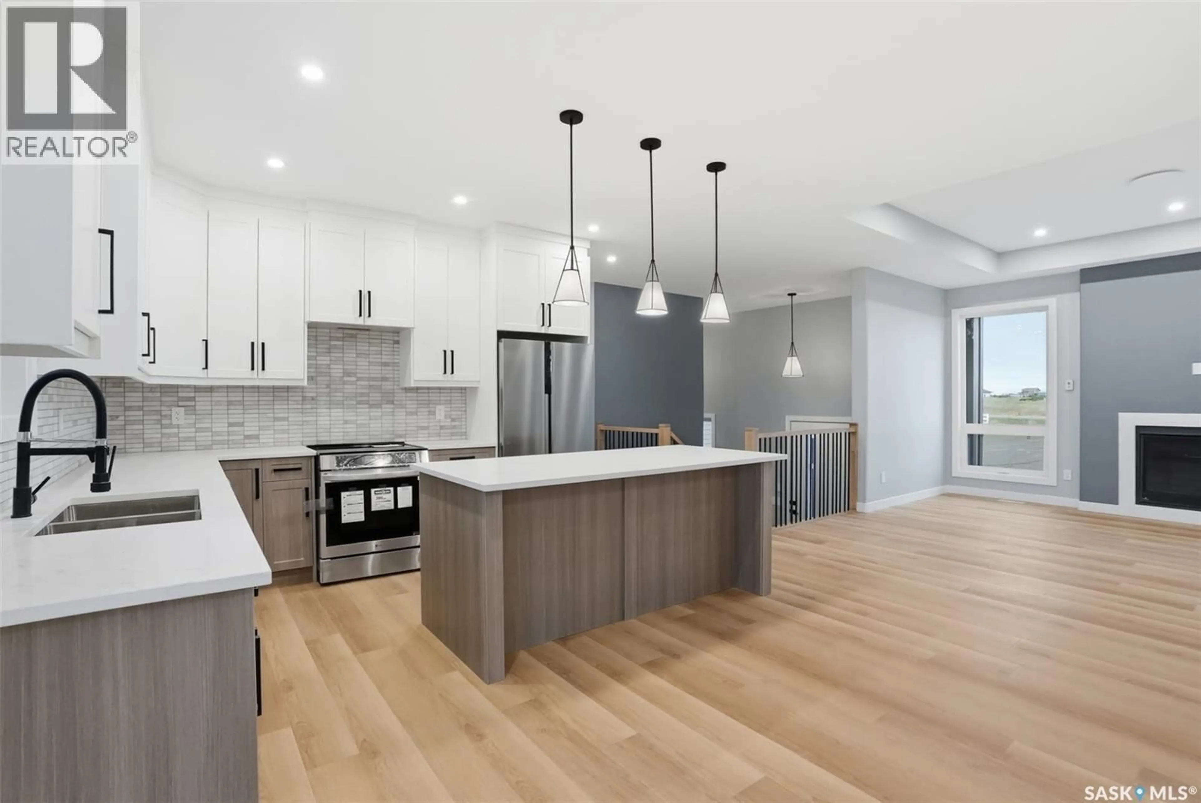 Open concept kitchen, wood/laminate floor for 12 CARDINAL DRIVE, Dundurn Rm No. 314 Saskatchewan S7C0C3
