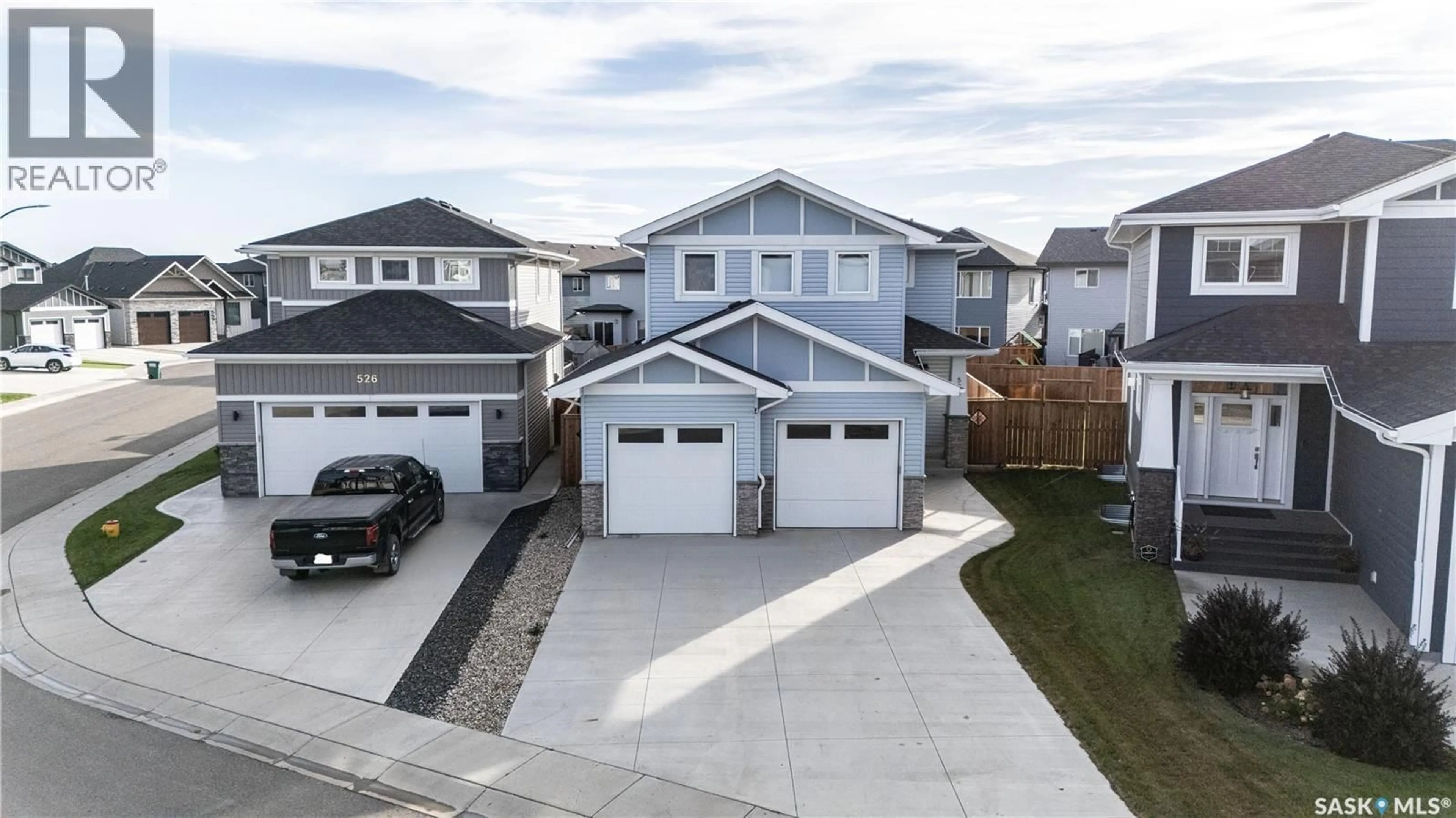 A pic from outside/outdoor area/front of a property/back of a property/a pic from drone, street for 522 DUBOIS MANOR, Saskatoon Saskatchewan S7V0R2